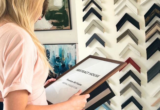 woman holding a premium hand made frame by Abstract House