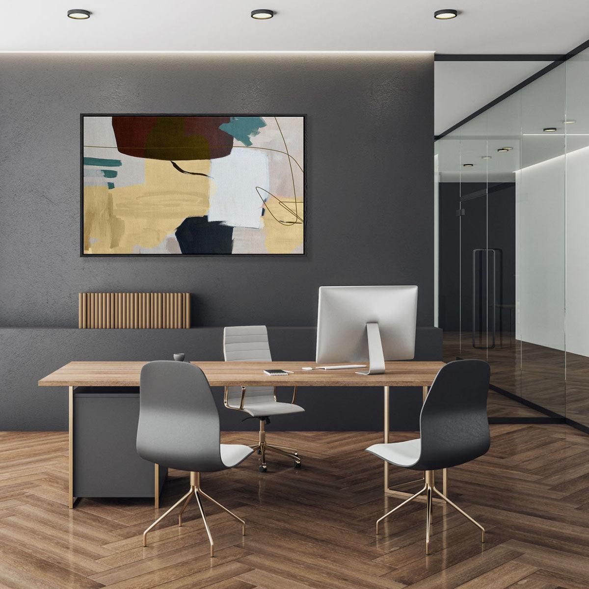 large abstract artwork in an office behind the desk