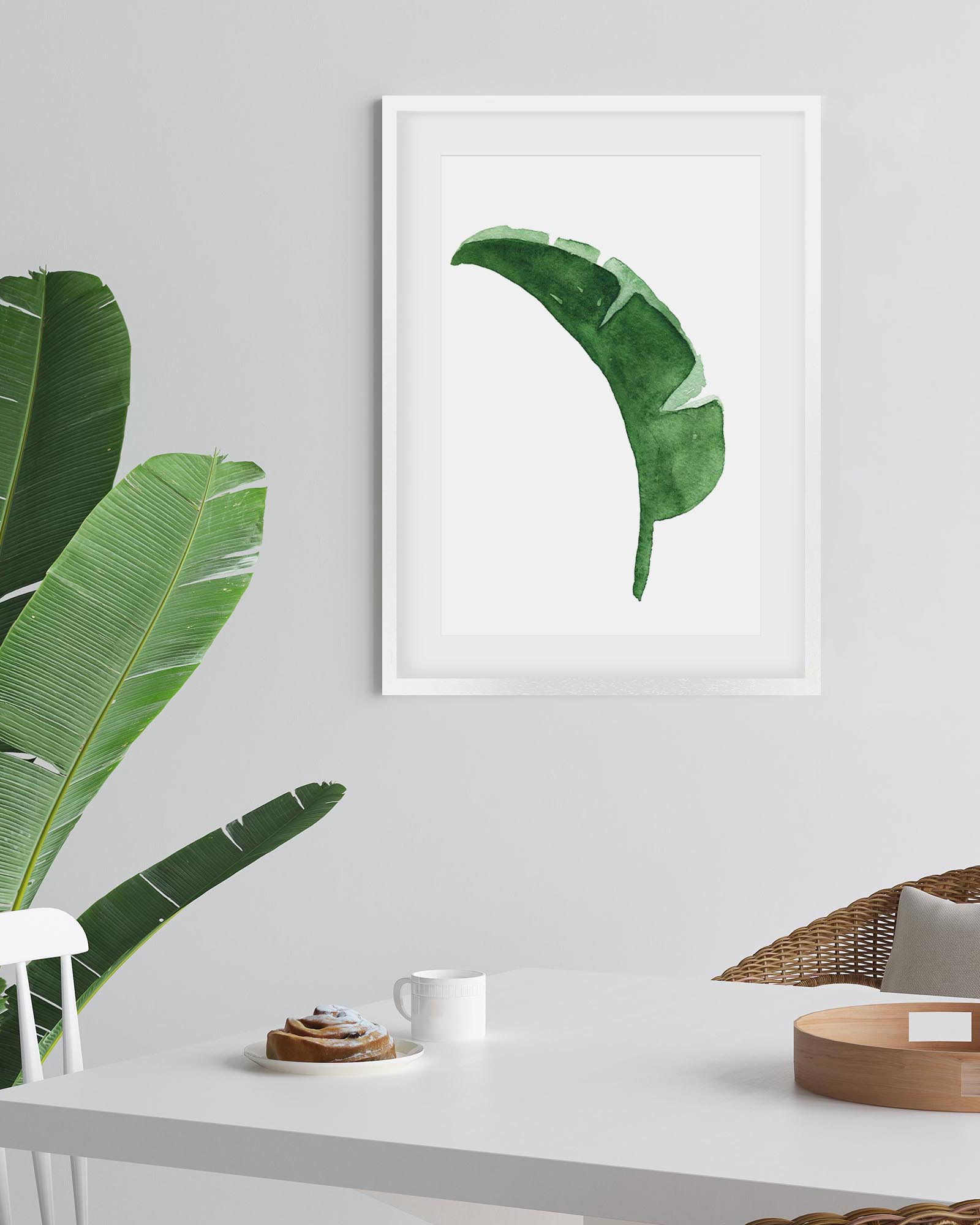framed watercolour botanical above dining table