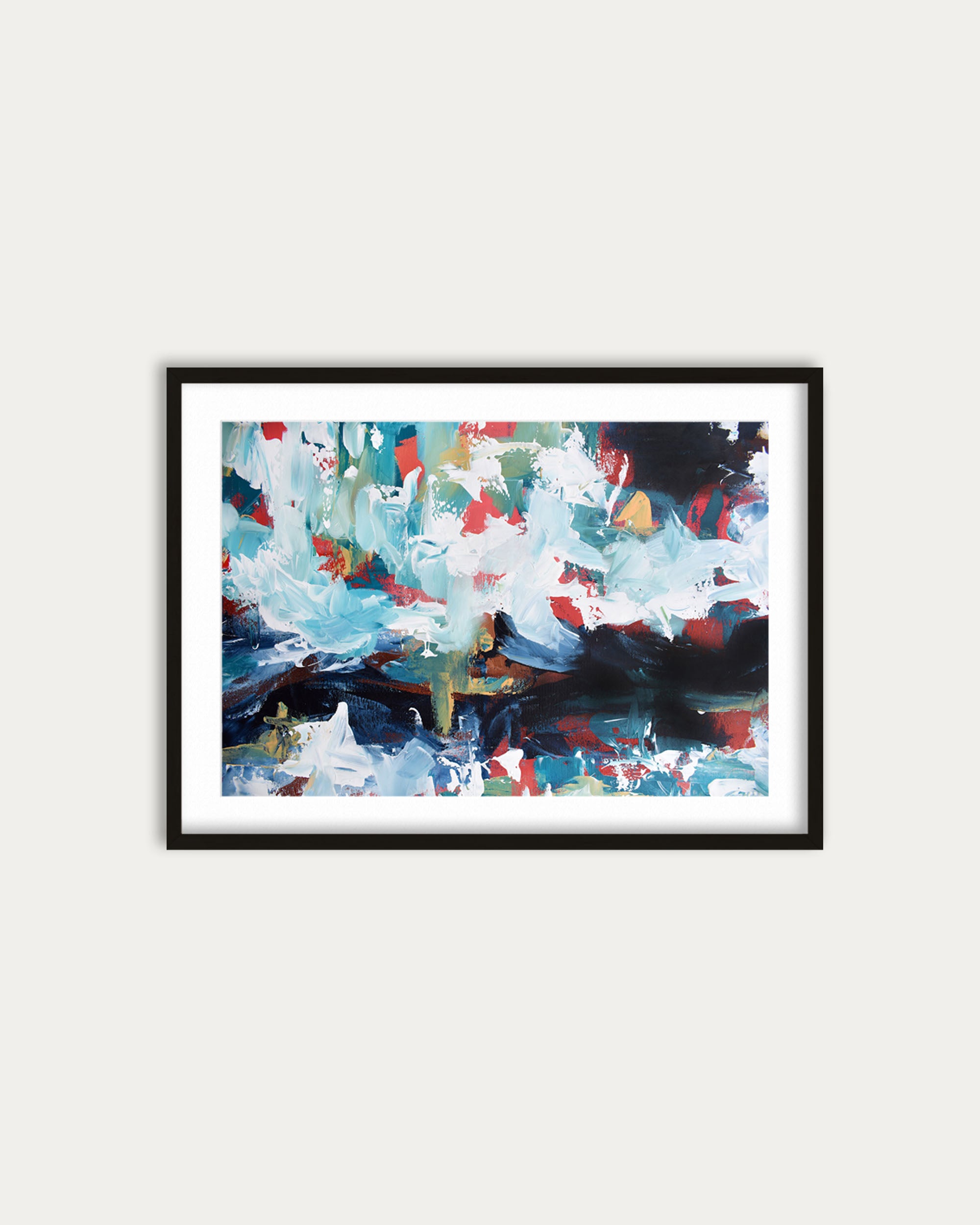 Framed abstract painting with colorful brush strokes on a white wall