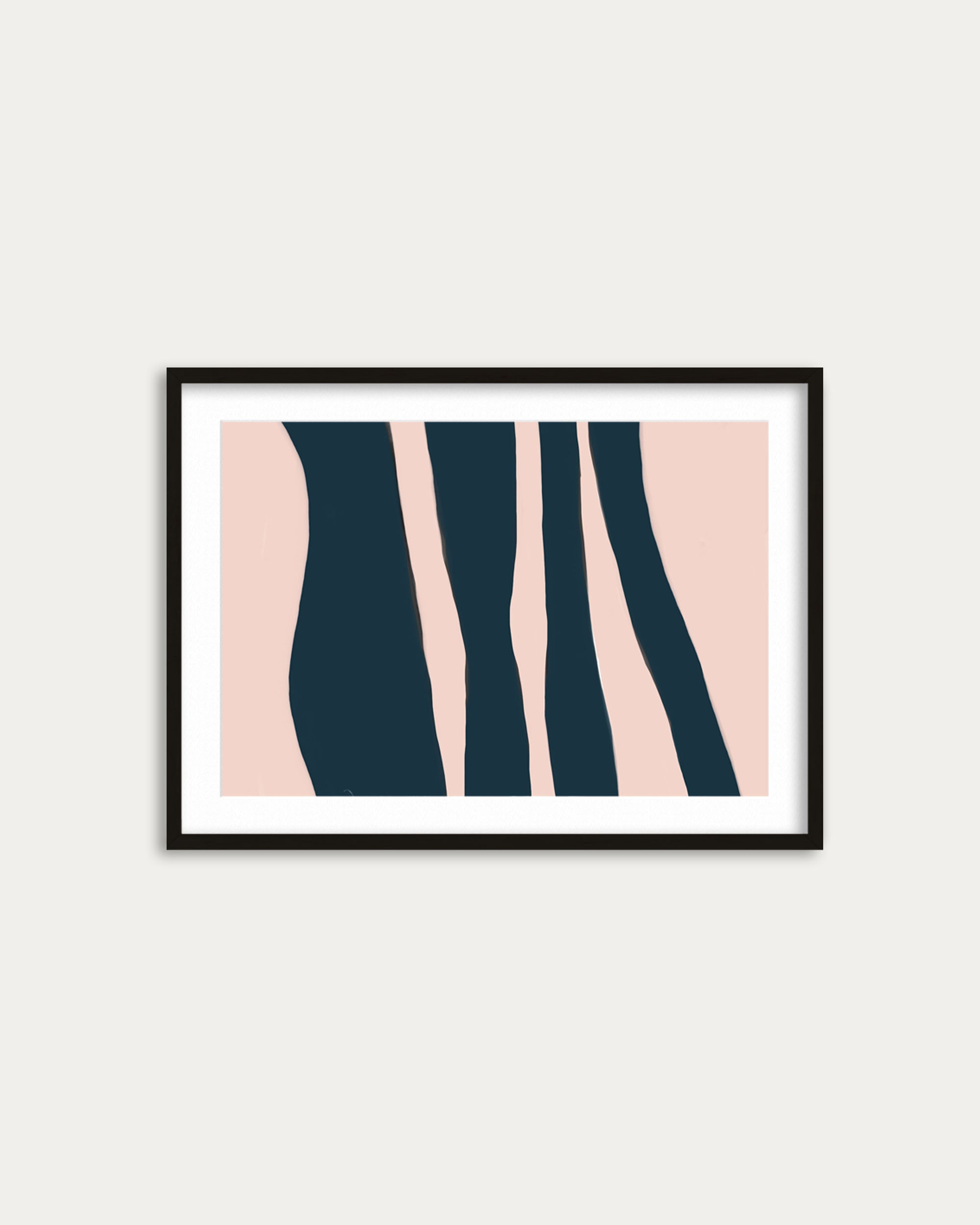 Framed abstract art print with pink and navy design on a white wall