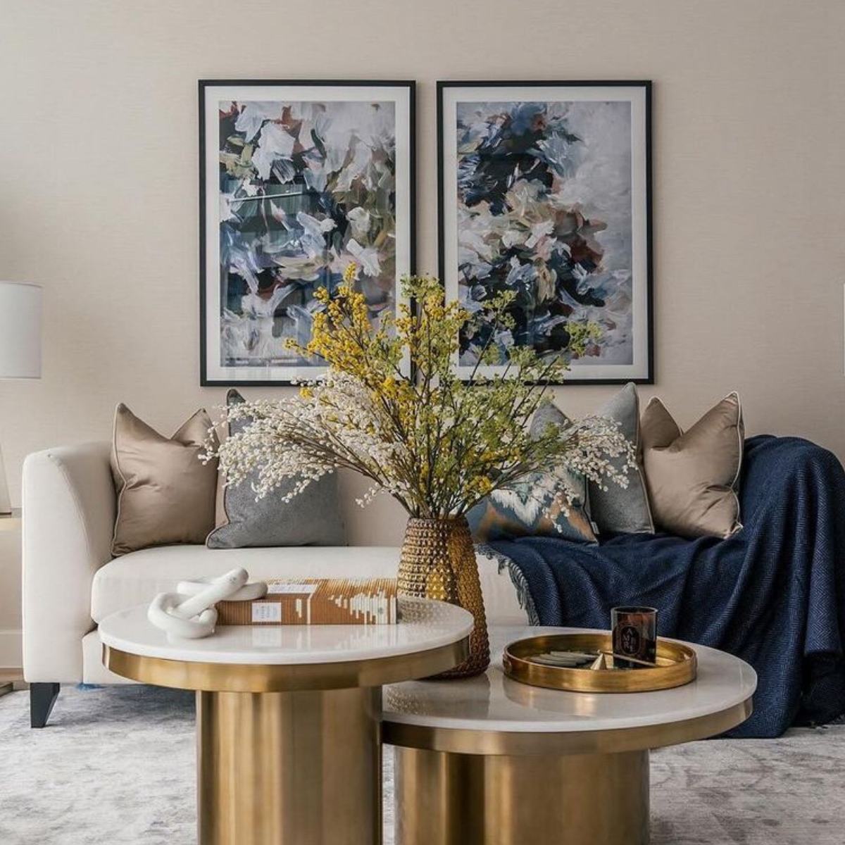 framed large abstract art on wall above sofa in a living room
