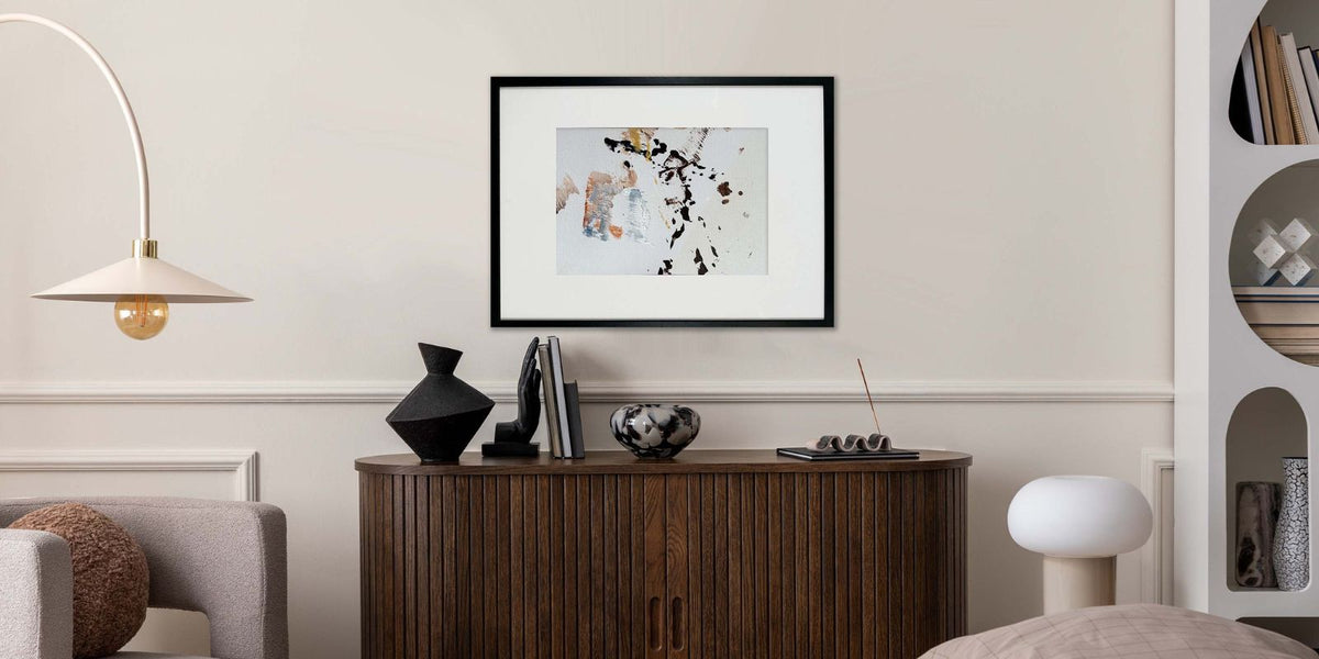 Original Abstract Painting Framed And Hung On A Wall Above A Sideboard In Modern Living Room