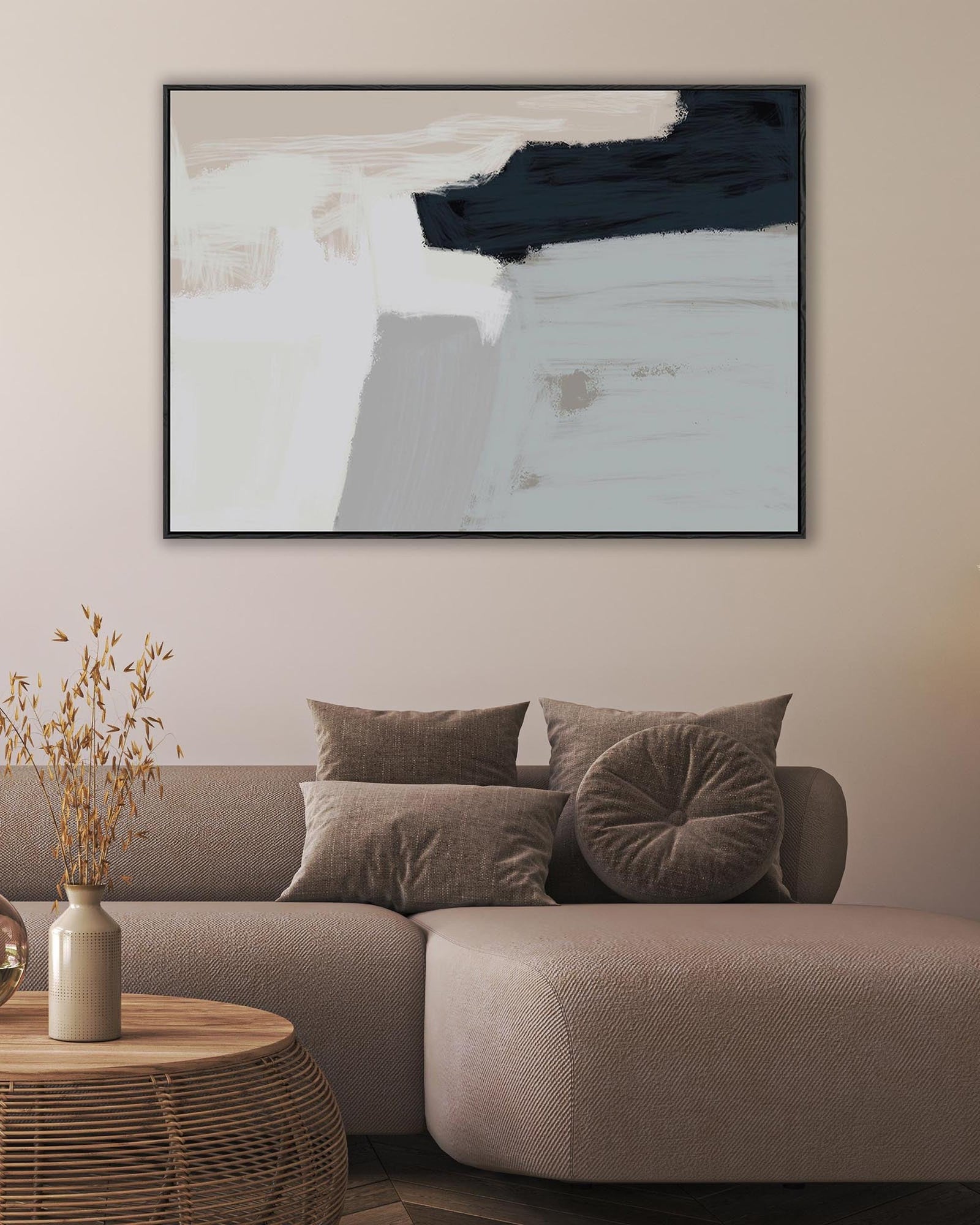 Modern living room with a gray sofa, abstract art on the wall, and decorative items.