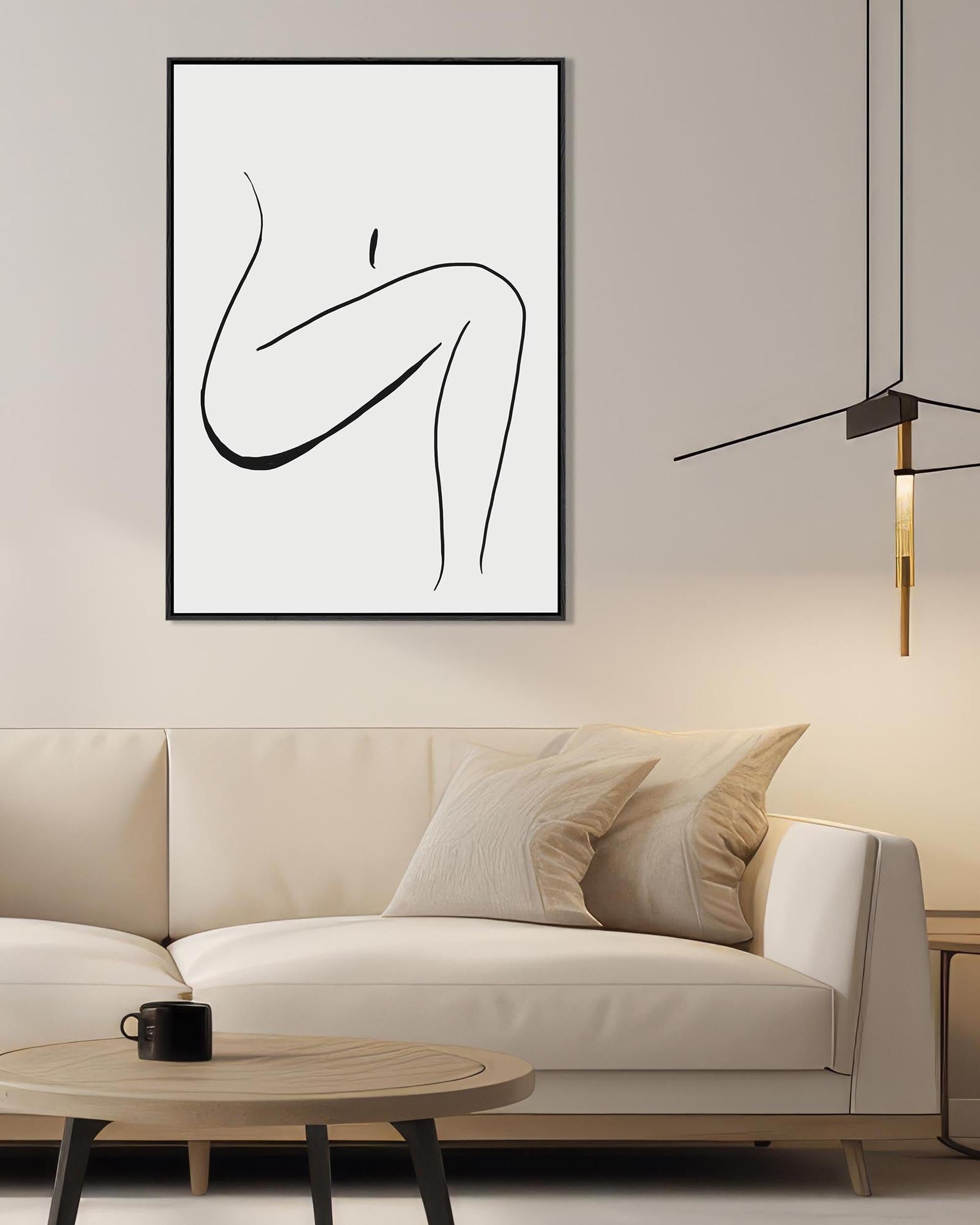 Modern living room with a white sofa, coffee table, and abstract line art on the wall.