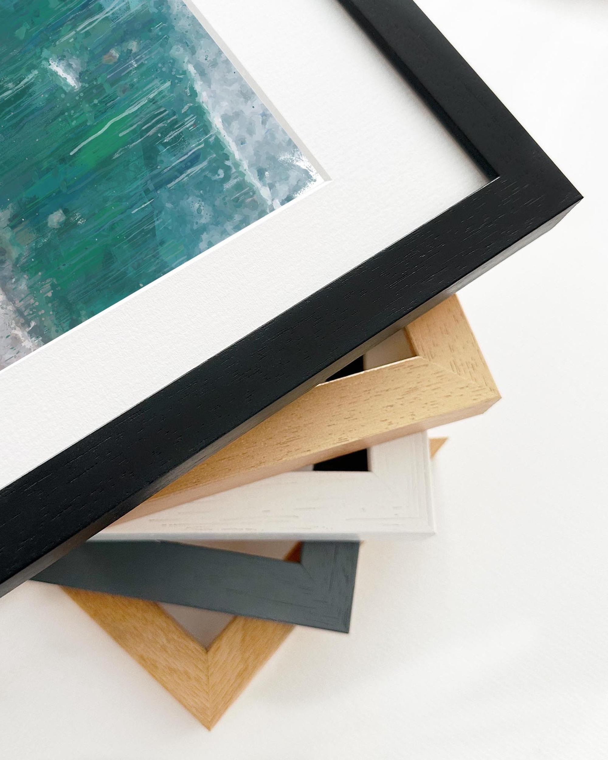 Stack of variously colored picture frames on a white background