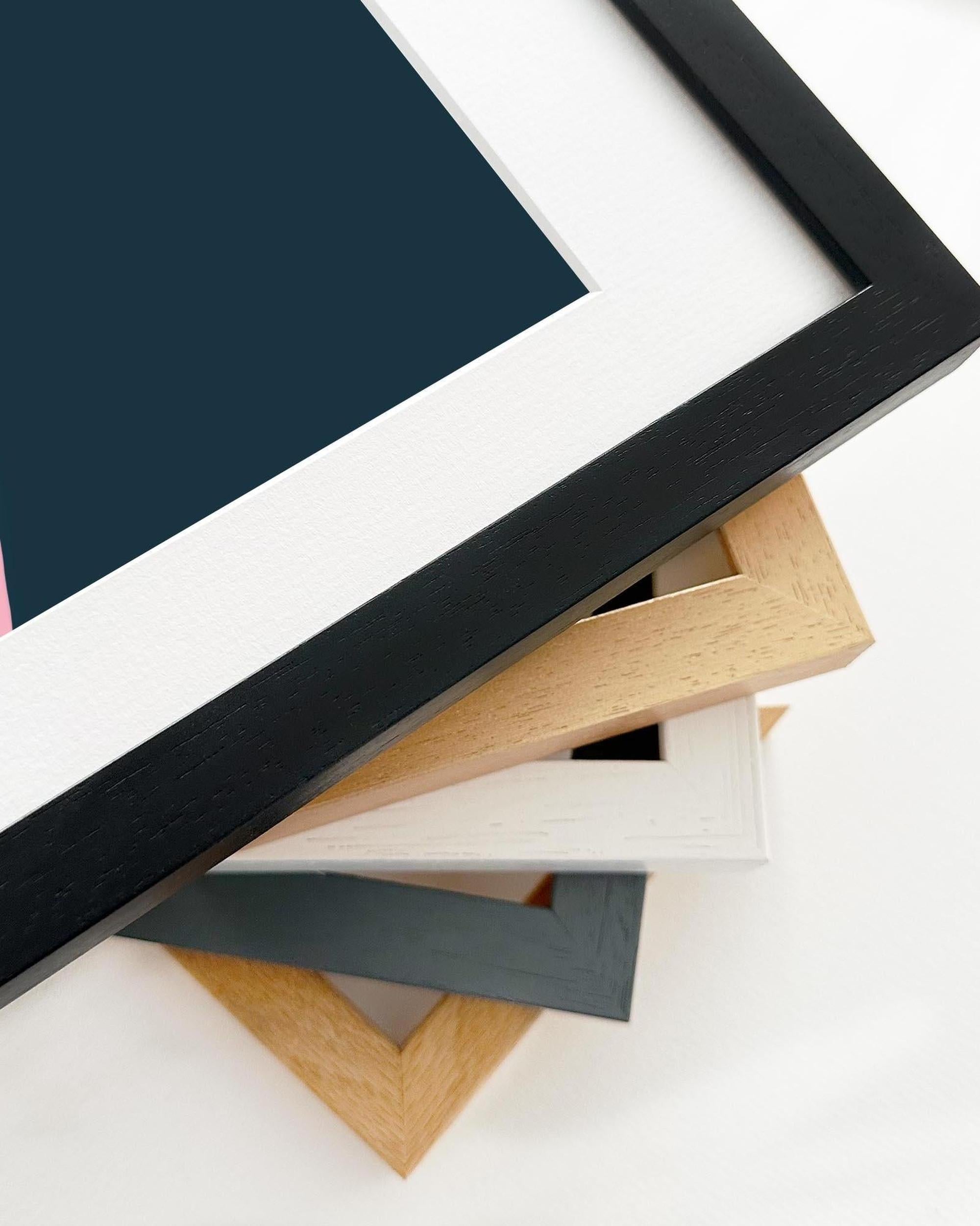 Collection of various wooden picture frames on a white background