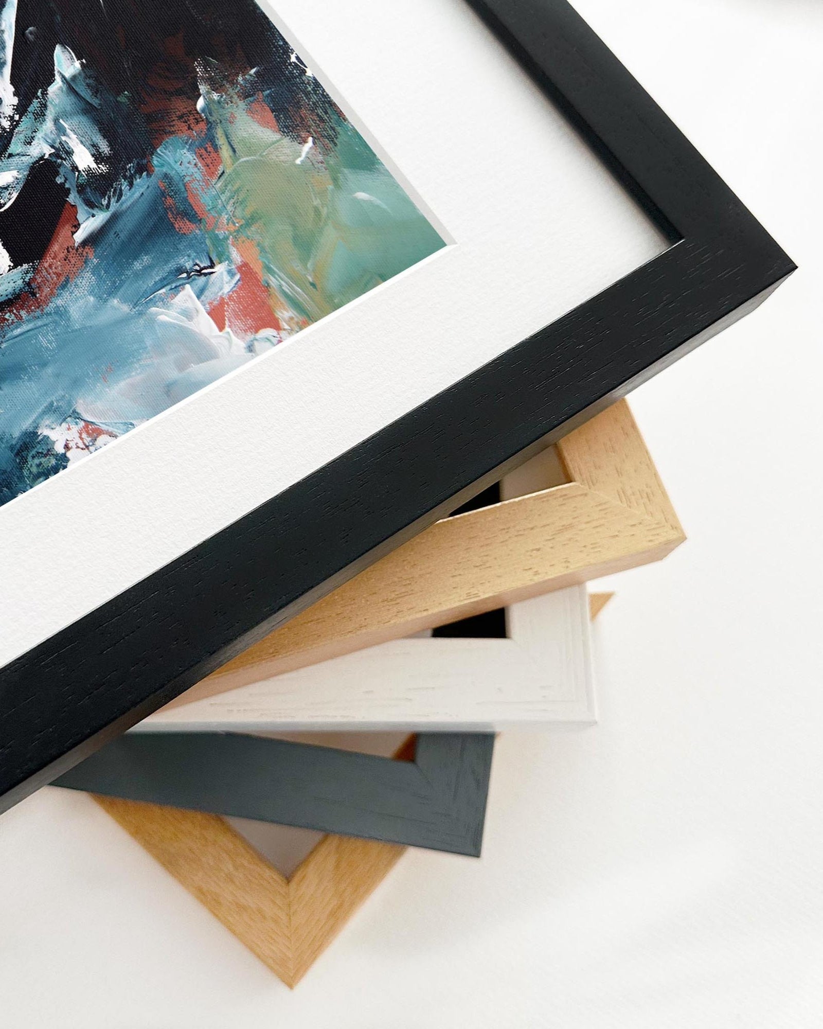 Stack of various photo frames on a white background