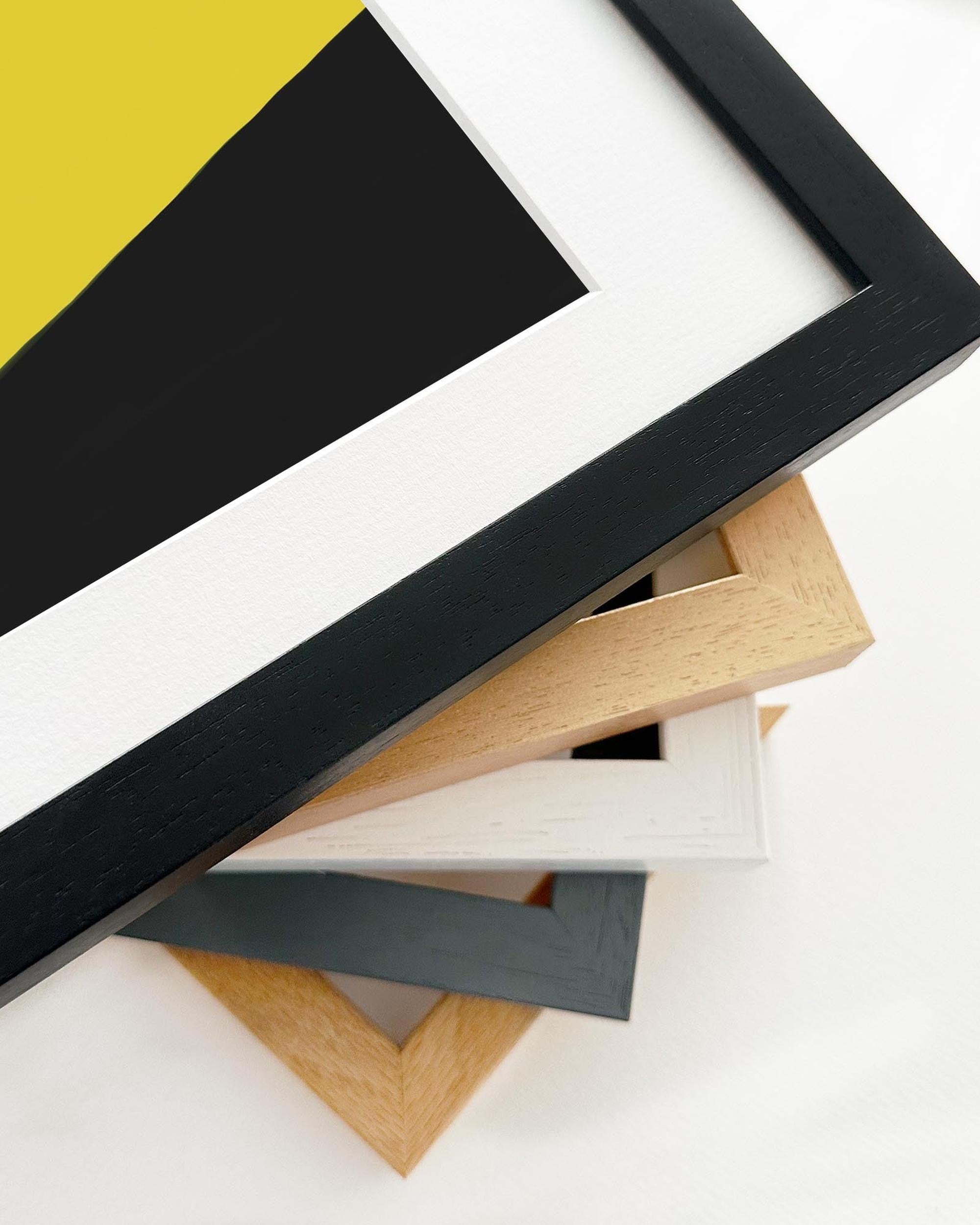 Collection of variously colored picture frames on a white background
