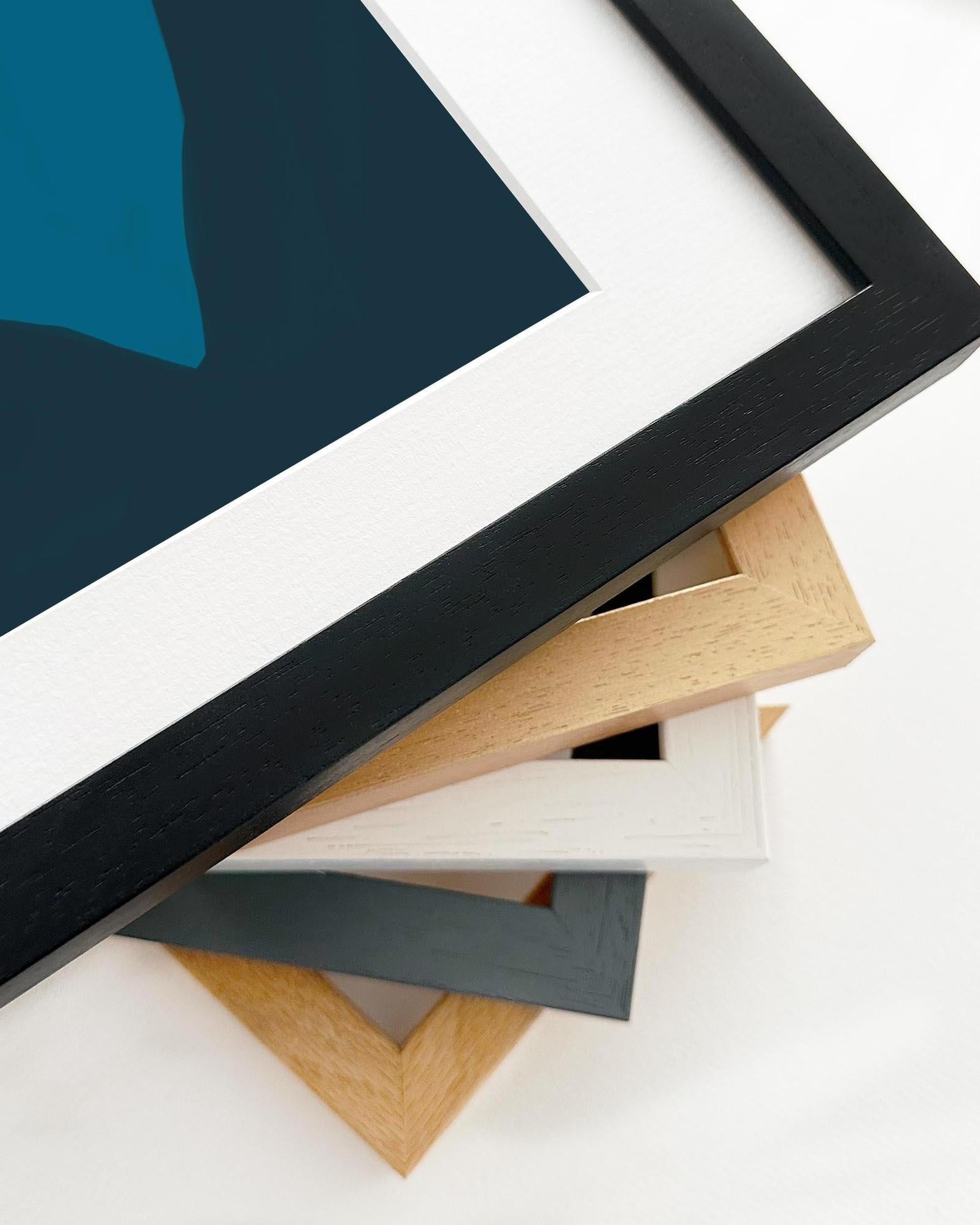 Collection of variously colored picture frames on a white surface