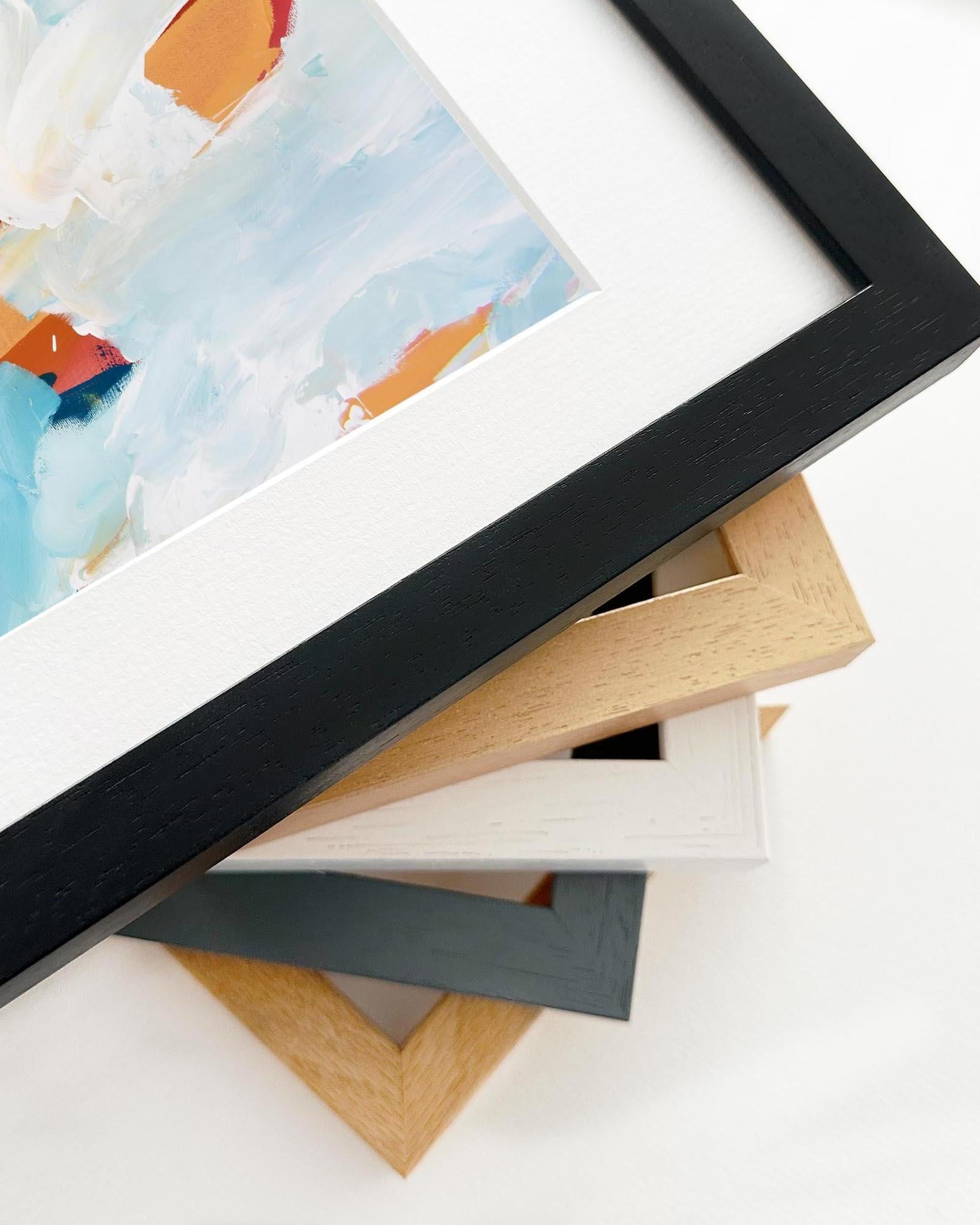 Stack of various photo frames on a white background