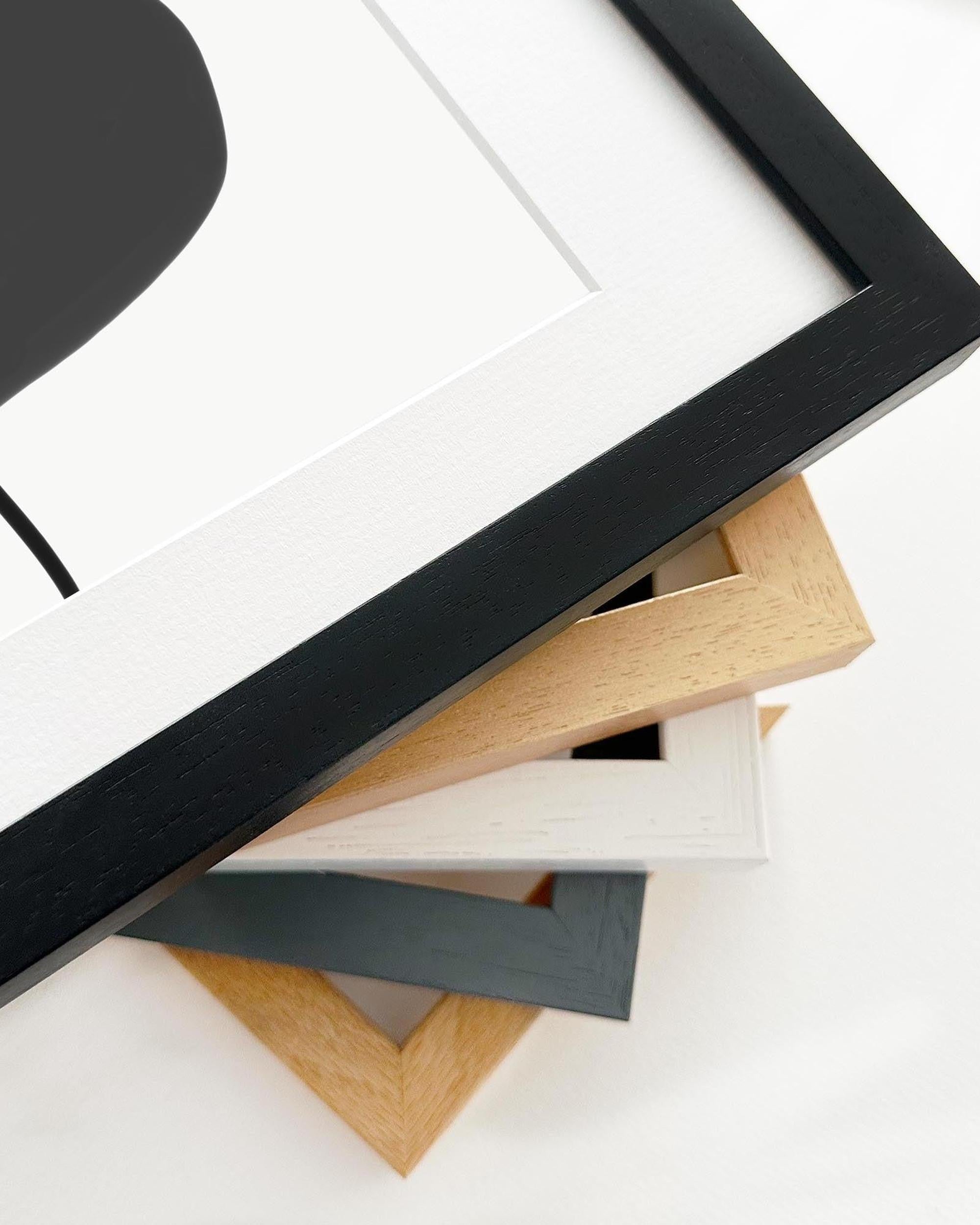 Collection of various wooden picture frames on a white background