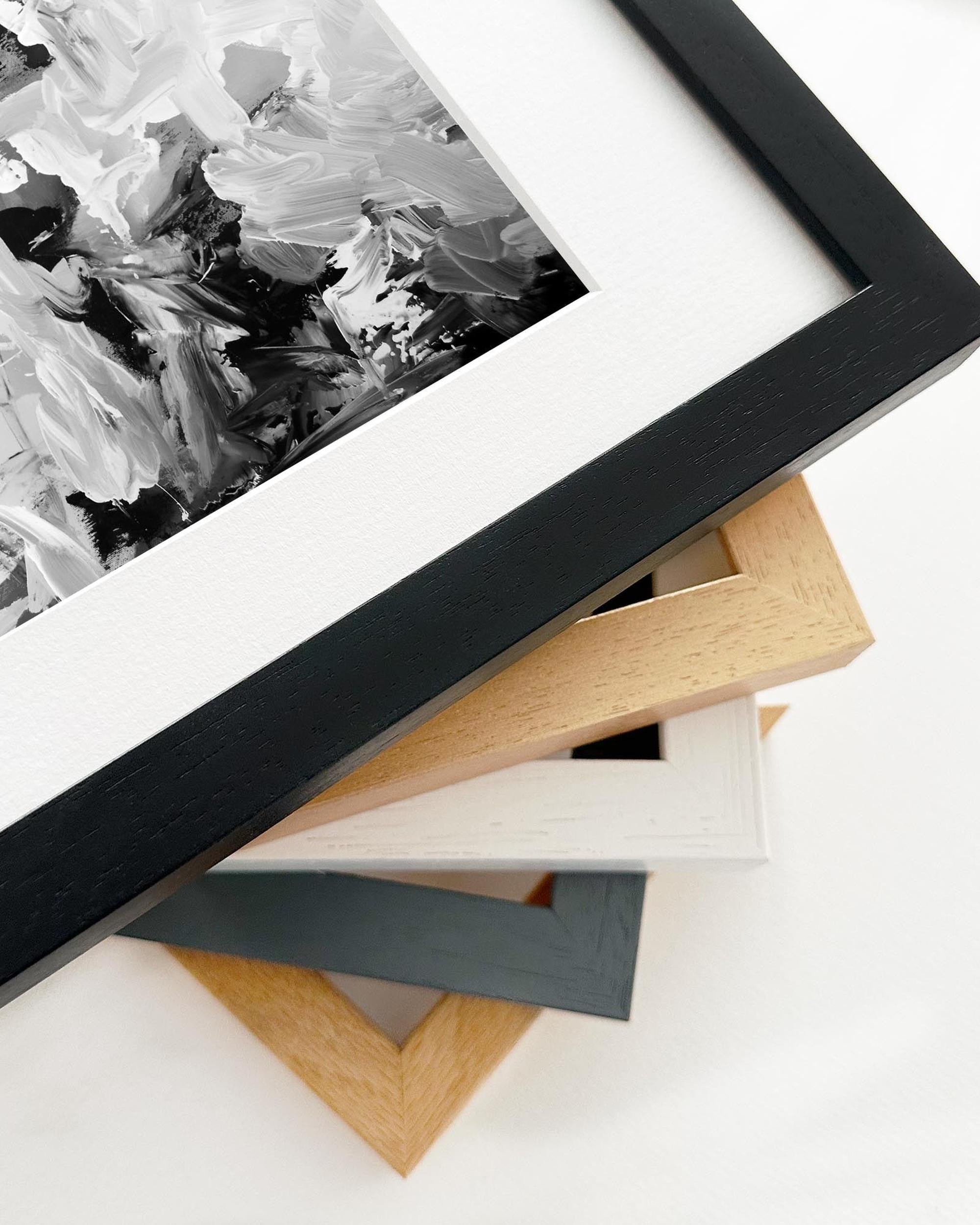 Collection of various picture frames on a white surface