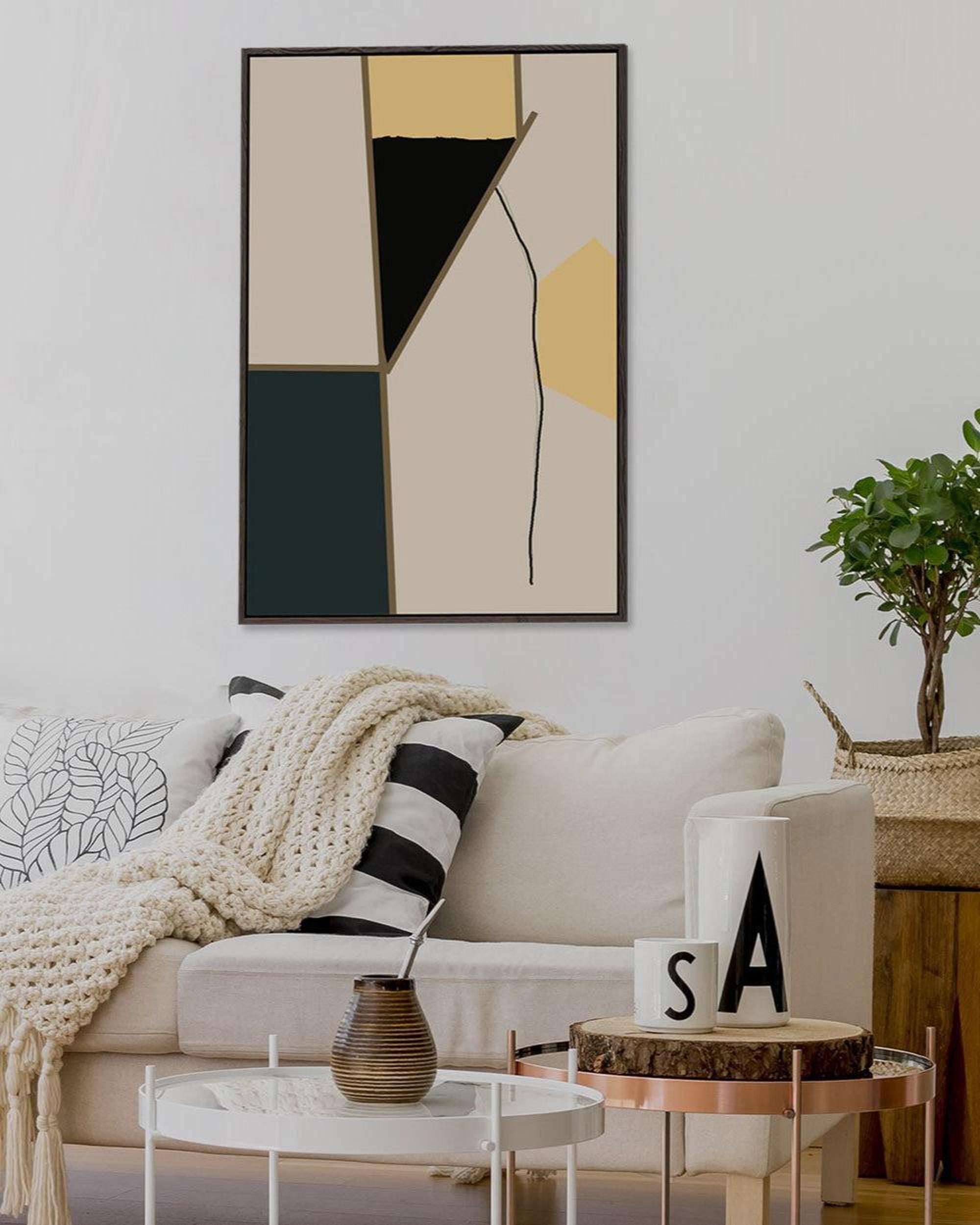 Modern living room with abstract art, sofa, and coffee table.