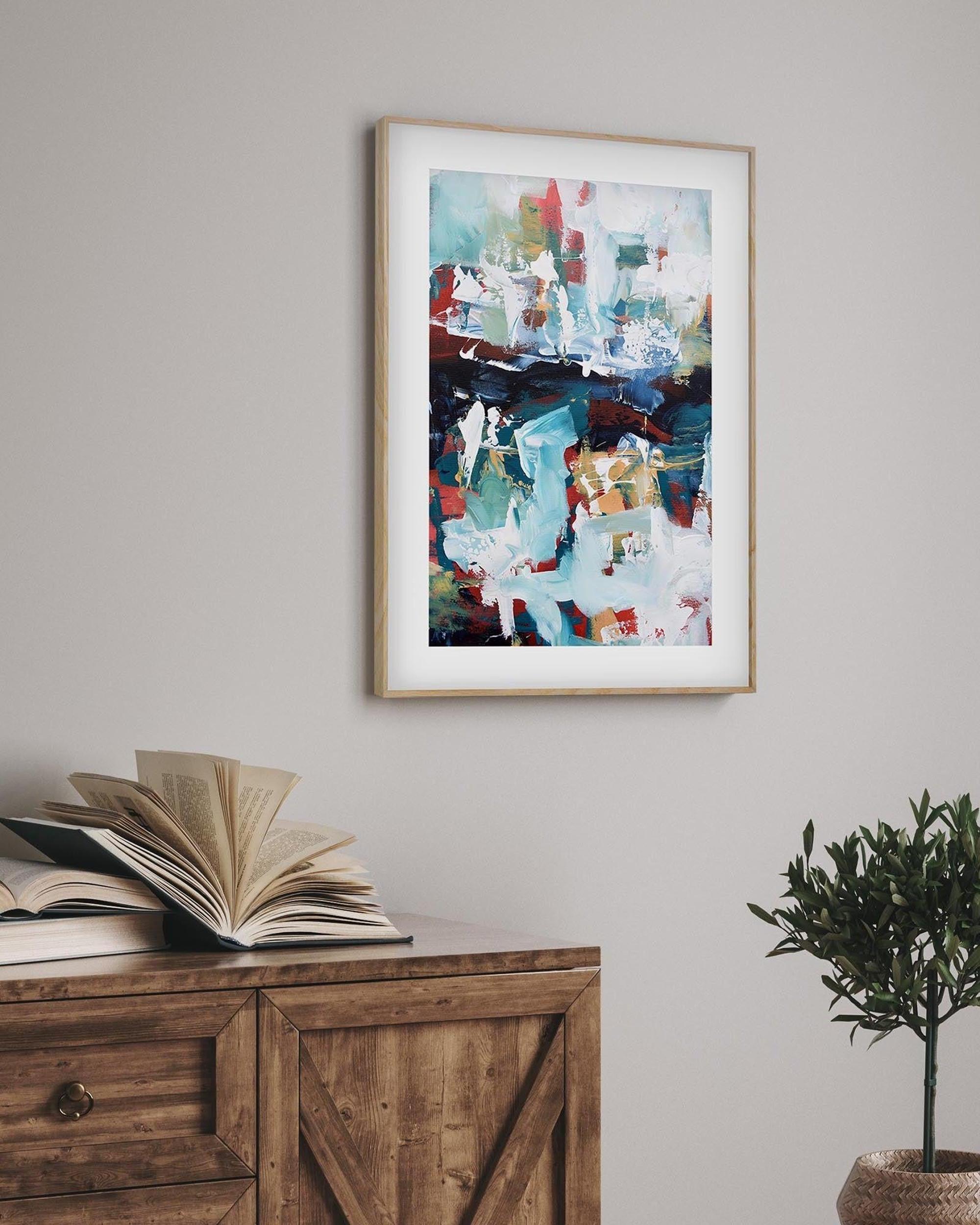 framed abstract poster in oak frame in a rustic living room