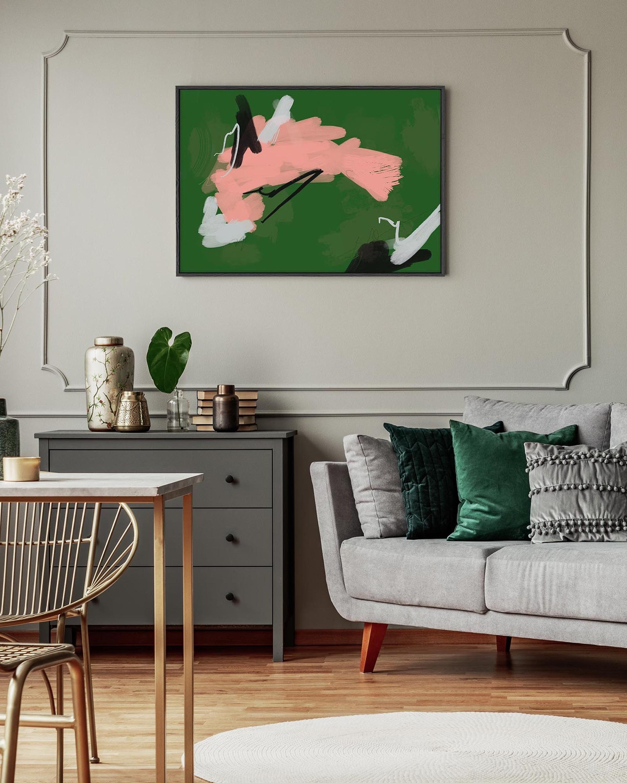 Living room with a gray sofa, abstract painting on the wall, and a small table.