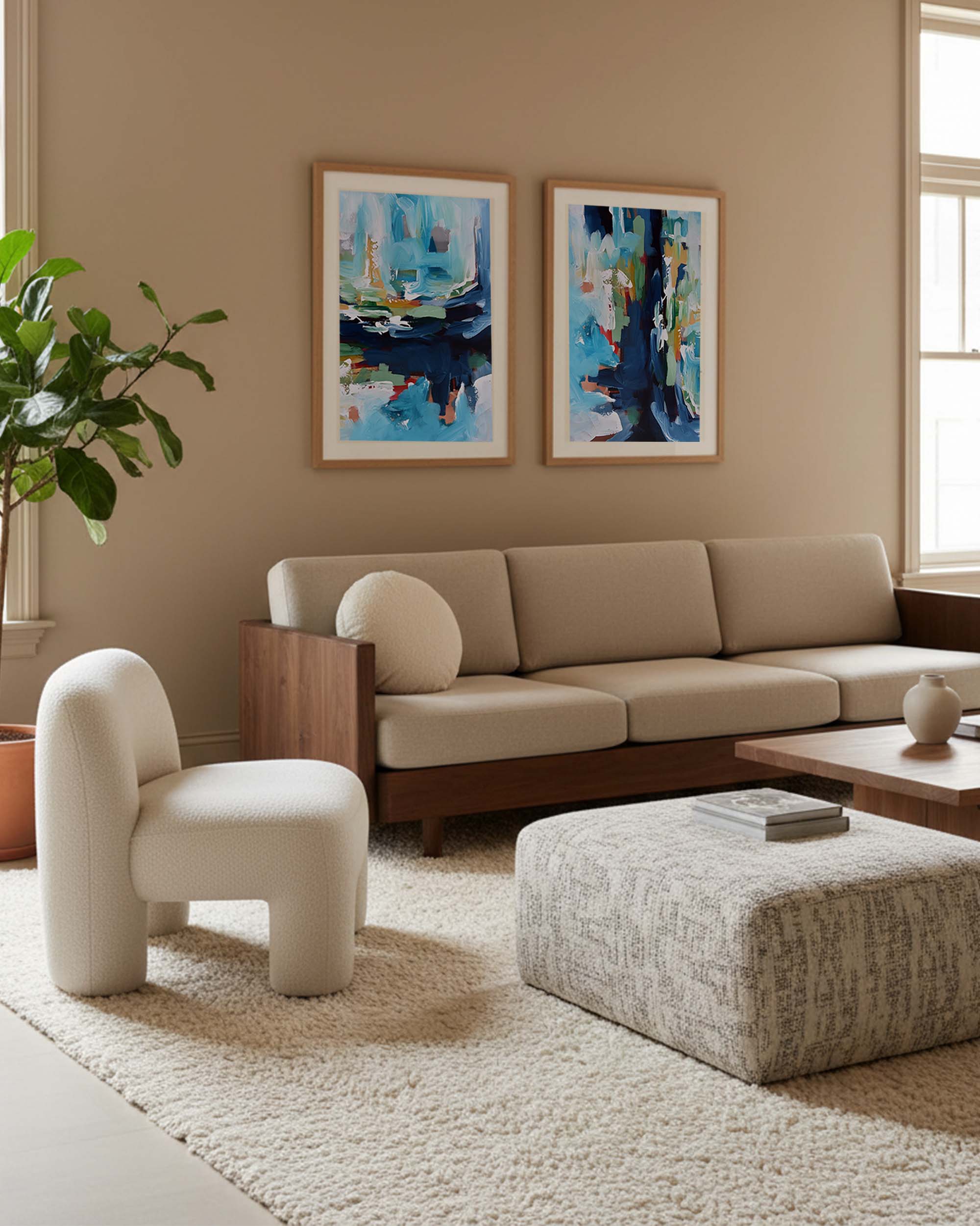 Modern living room with beige sofa, white armchair, and abstract art on the wall.