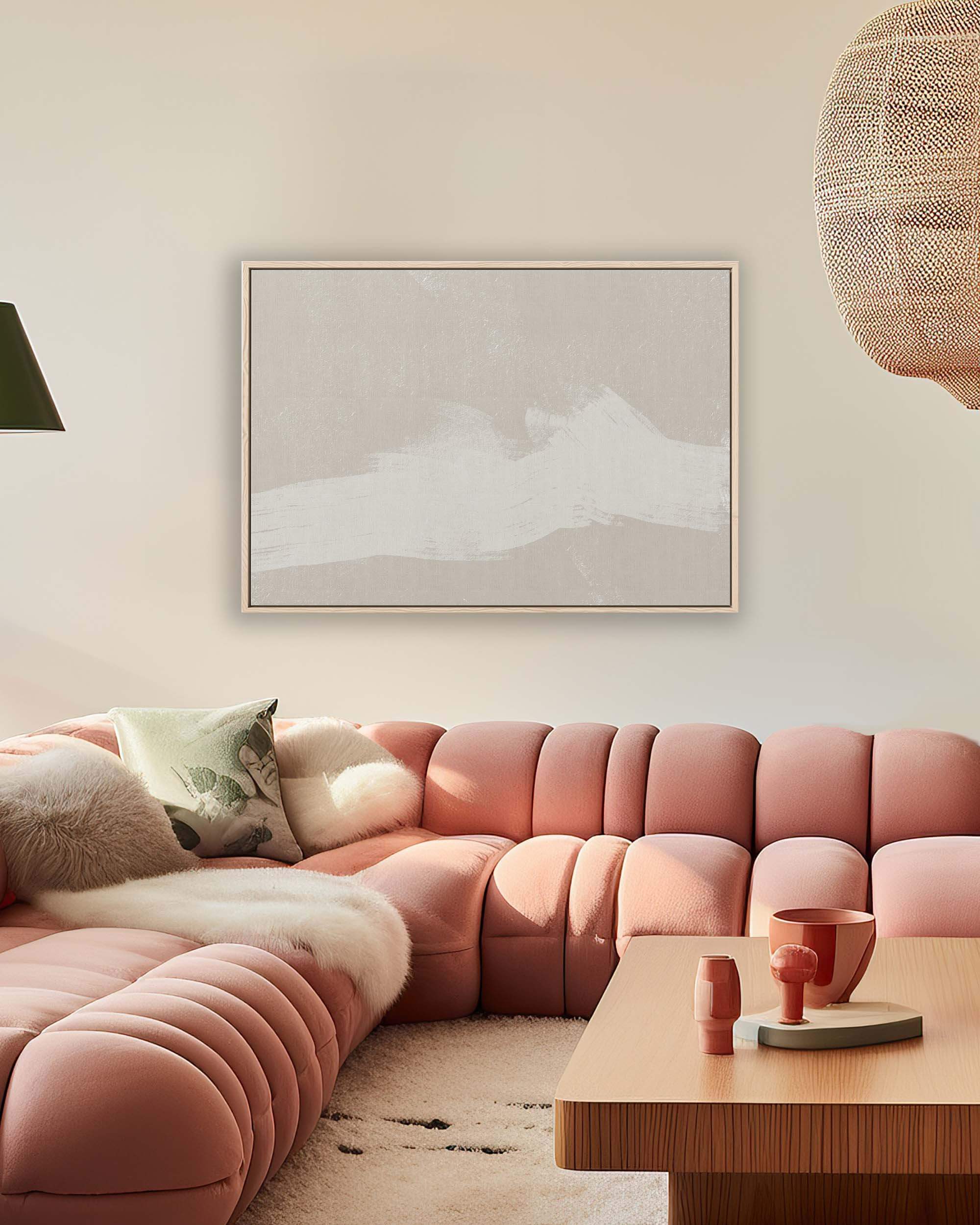 neutral abstract wall art in contemporary living room with blush pink sofa