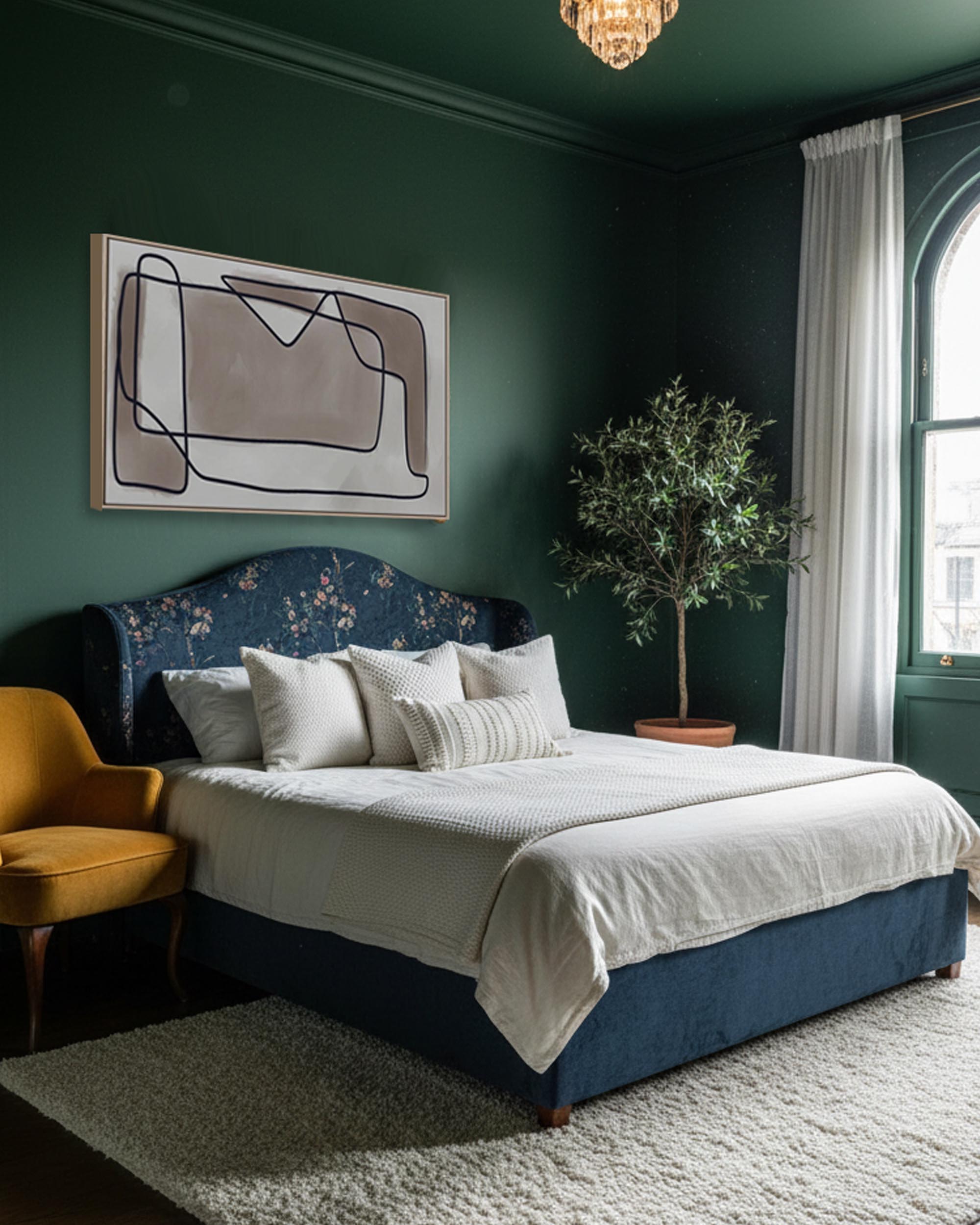 Modern bedroom with dark green walls, a blue bed, and abstract art.