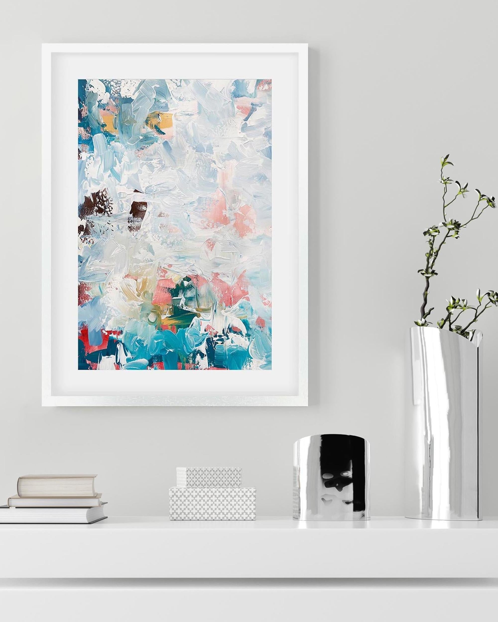 Framed abstract art print on a wall with decorative items below.