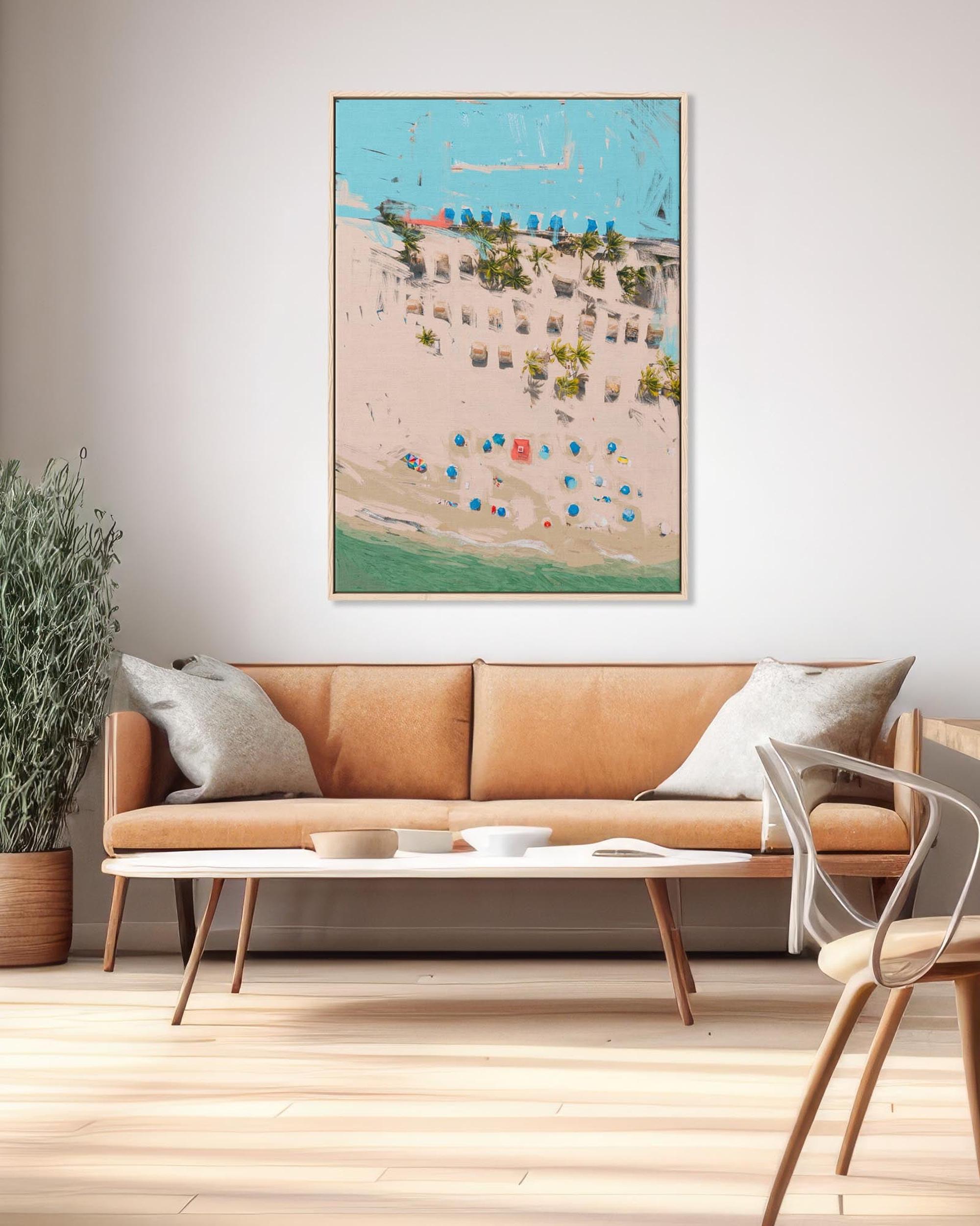 Living room with a brown sofa, coffee table, and decorative wall art.