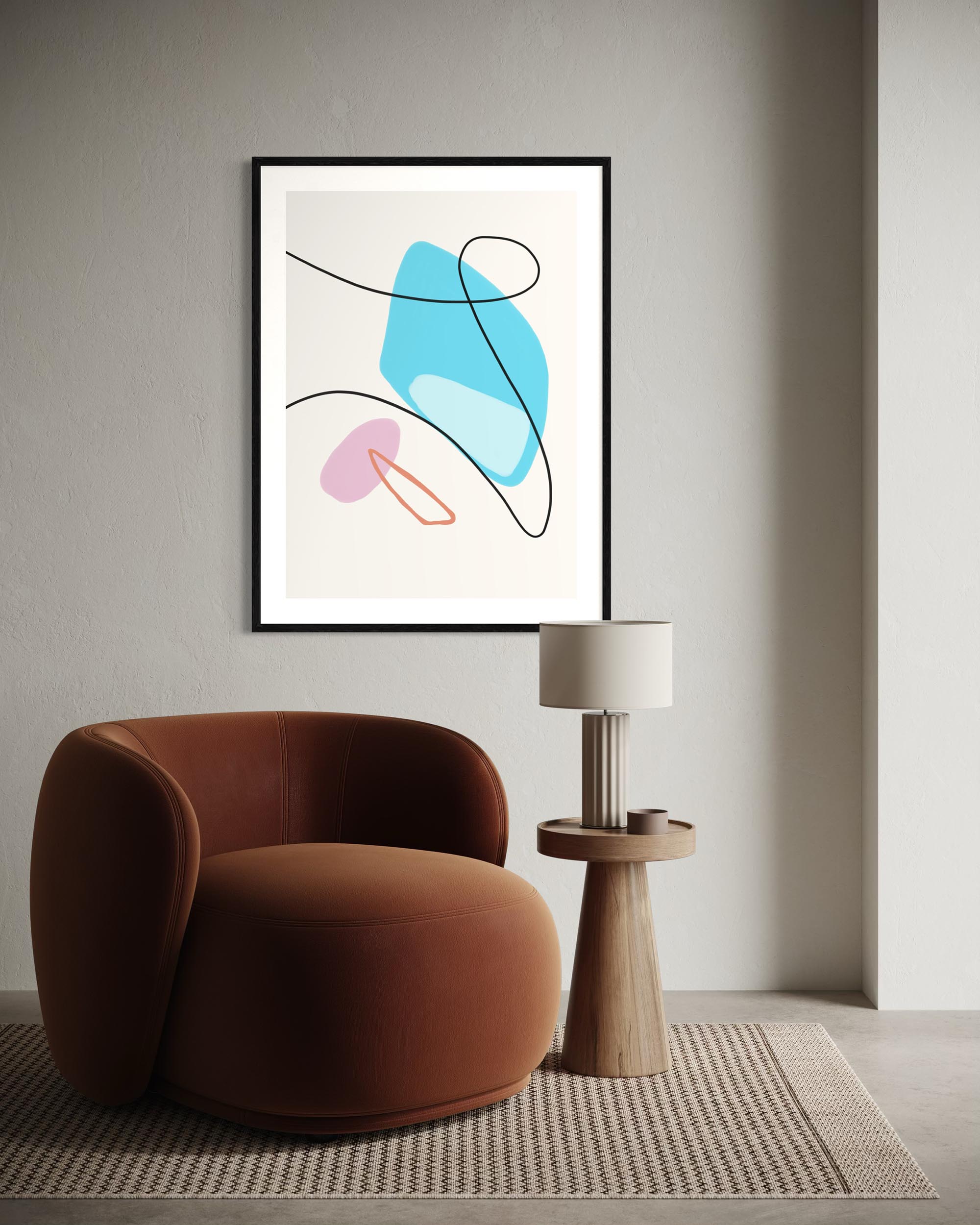 Modern interior with a brown armchair, abstract art, and side table.