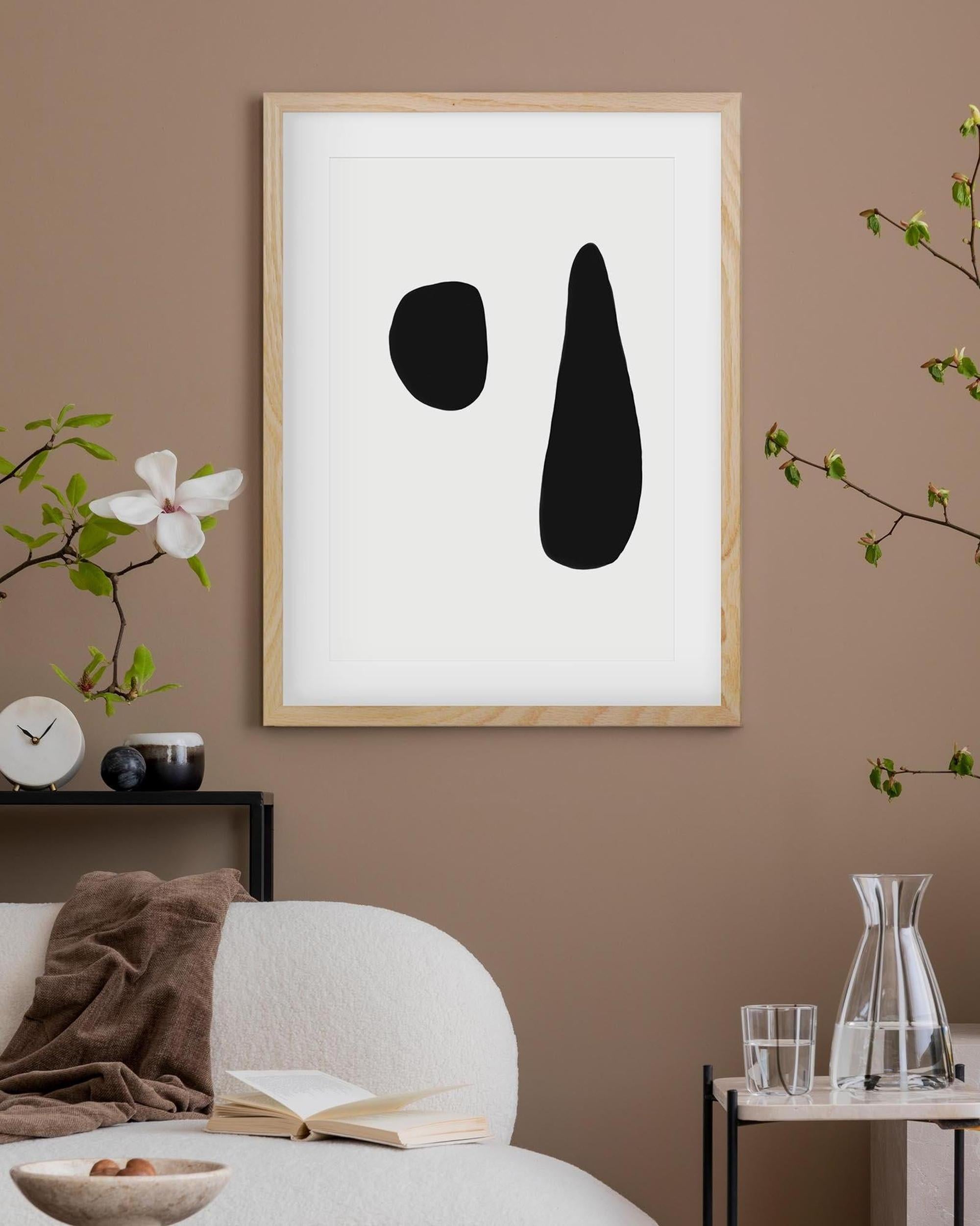 Framed abstract art piece on a wall with minimal decor