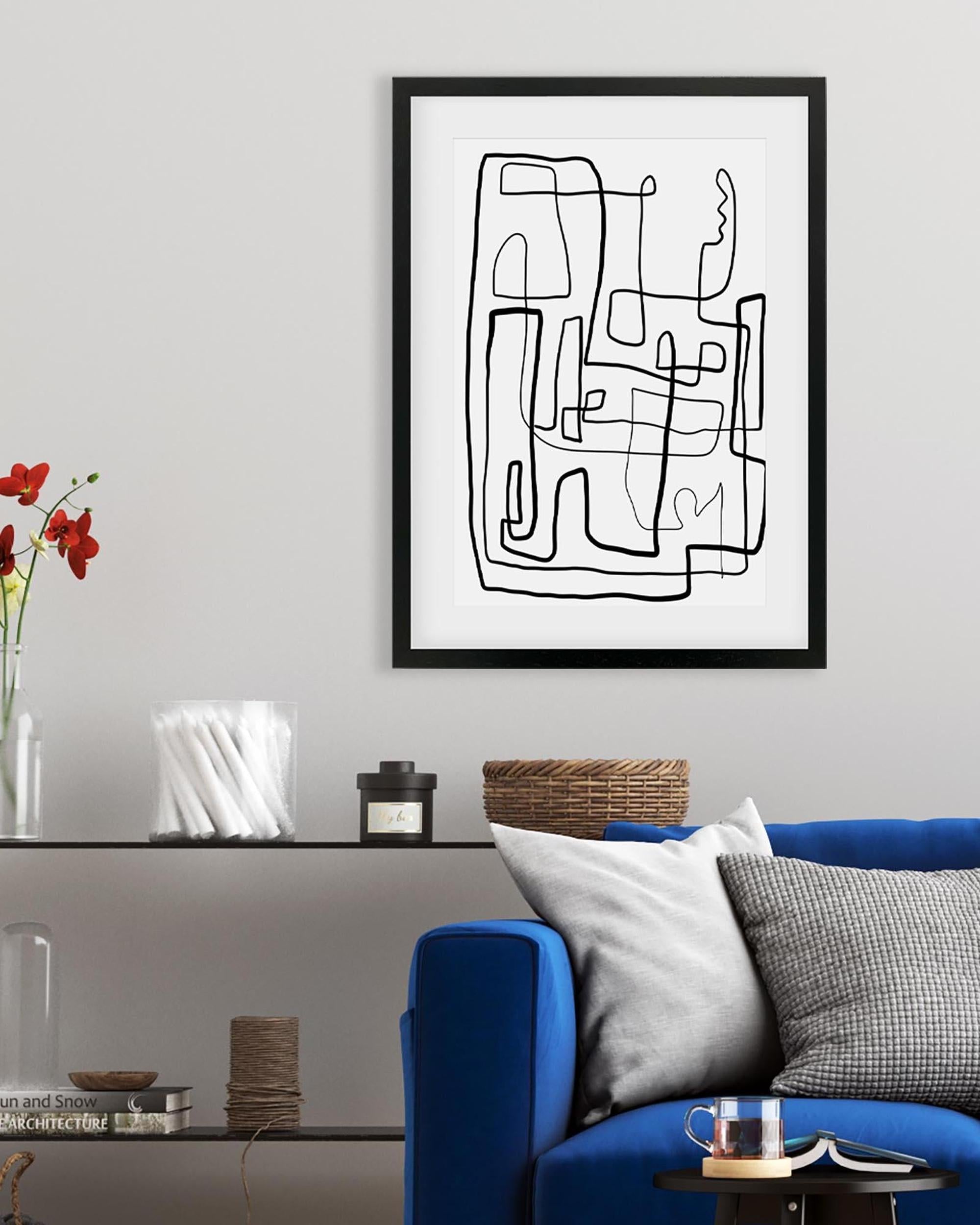 Abstract line art print on a wall above a blue sofa with decorative items.