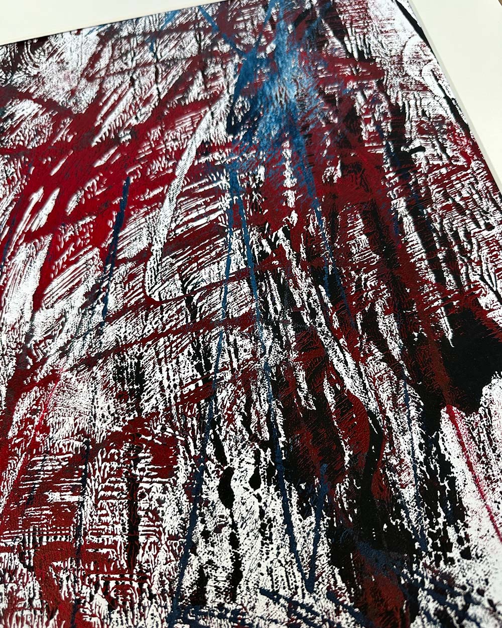Abstract art with red, blue, and black brush strokes on a white background