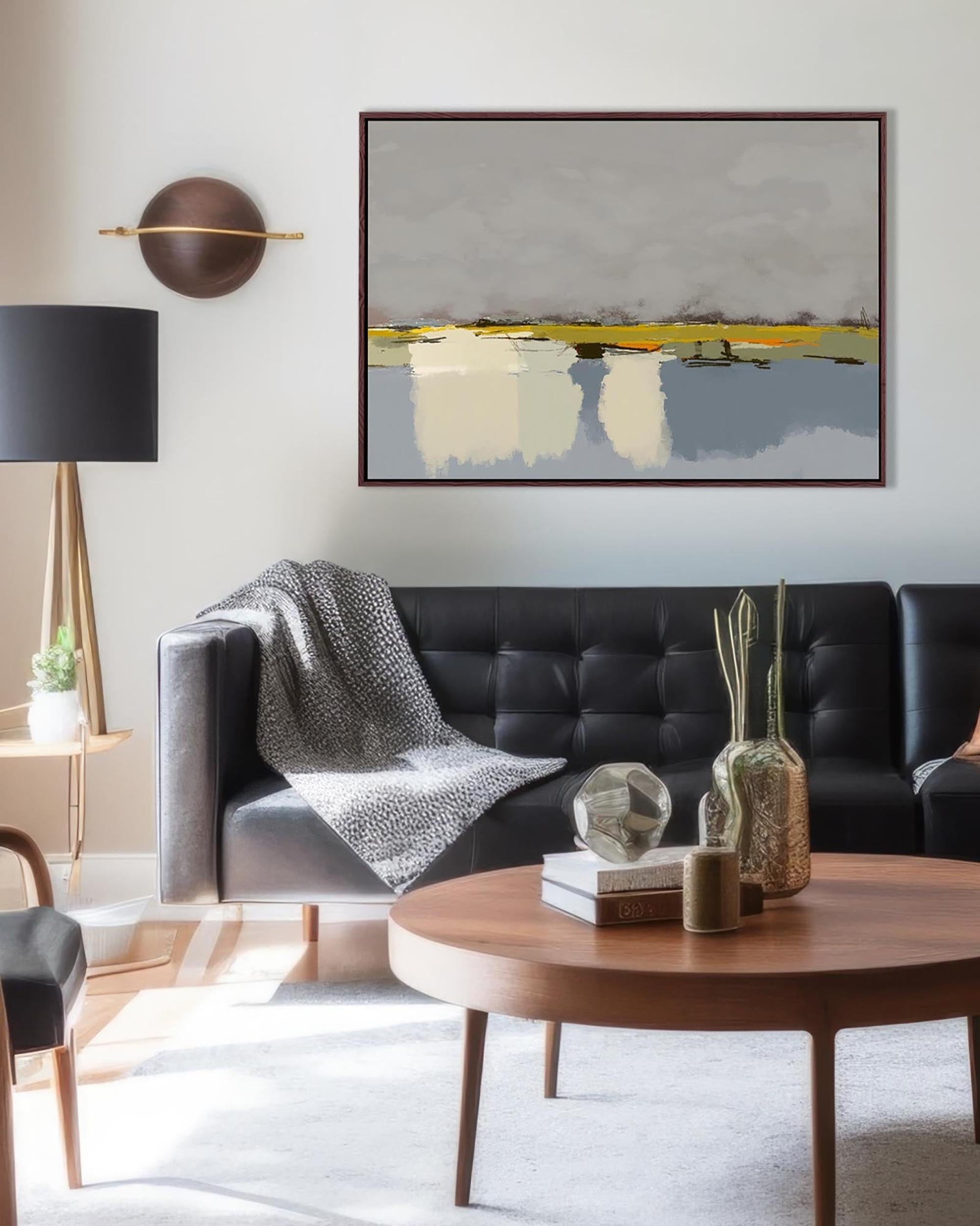 Modern living room with a black sofa, wooden coffee table, and abstract art on the wall.
