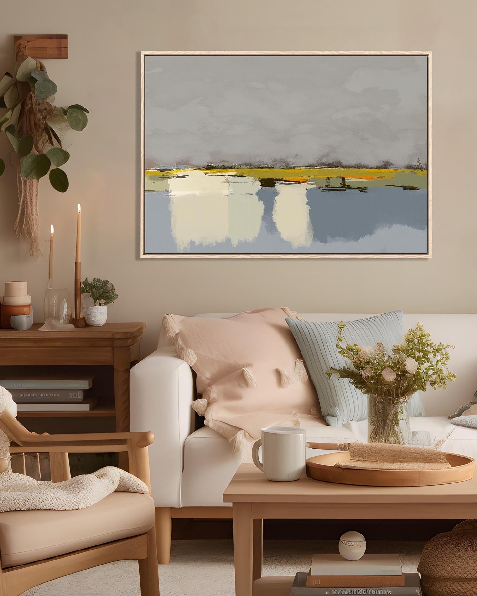 Living room with a painting on the wall, sofa, coffee table, and decorative items.