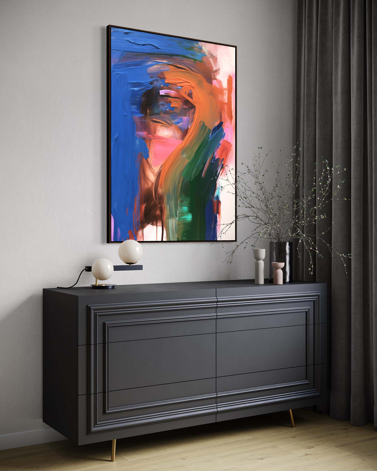 Modern interior with a dark gray dresser and abstract painting on a light gray wall.