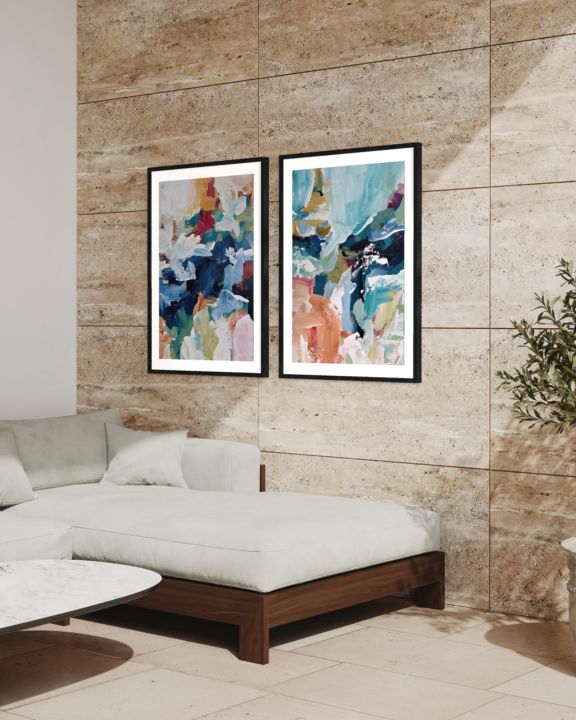 Two abstract paintings on a wall above a sofa in a living room.