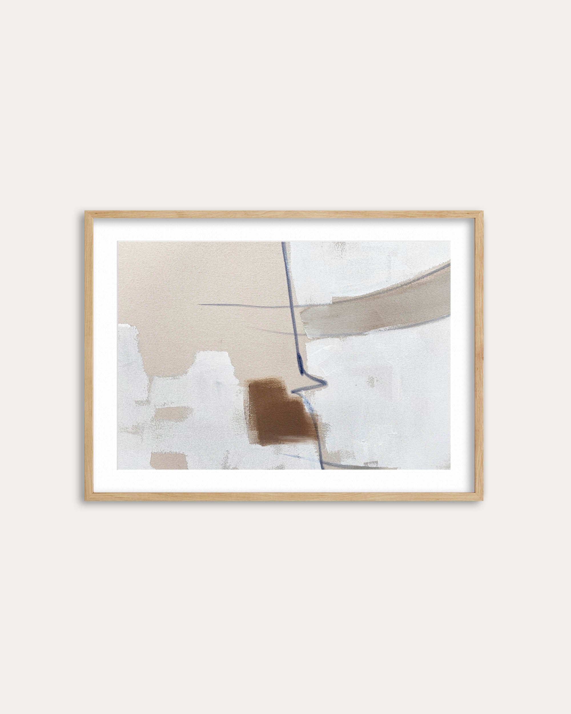 Framed abstract art piece on a white wall