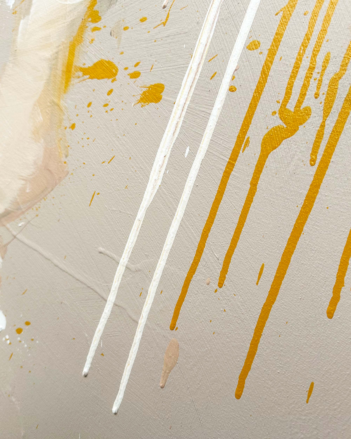 Abstract art with white and yellow paint strokes on a textured beige background