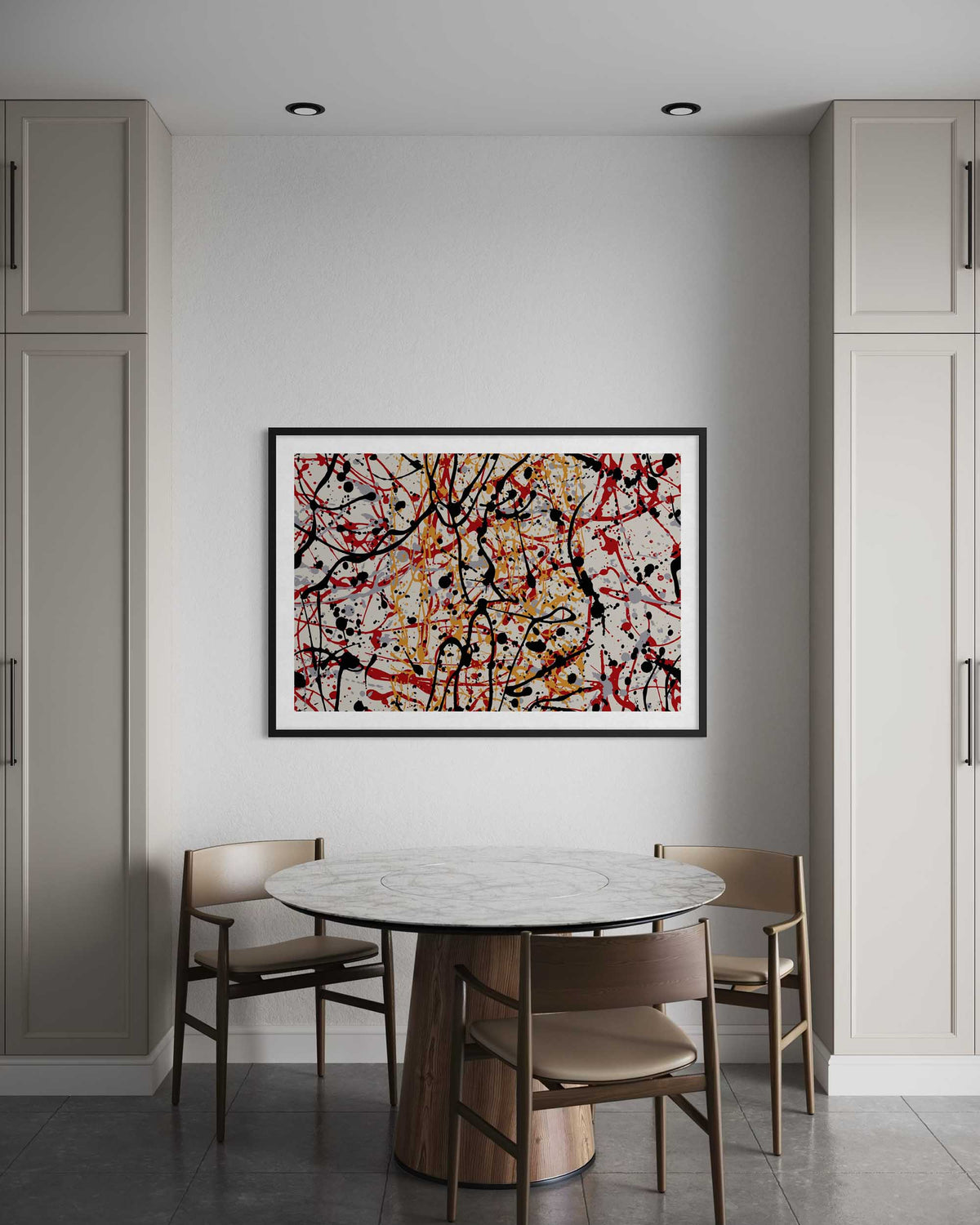Dining room with a round table and chairs, abstract art on the wall, and gray cabinets.