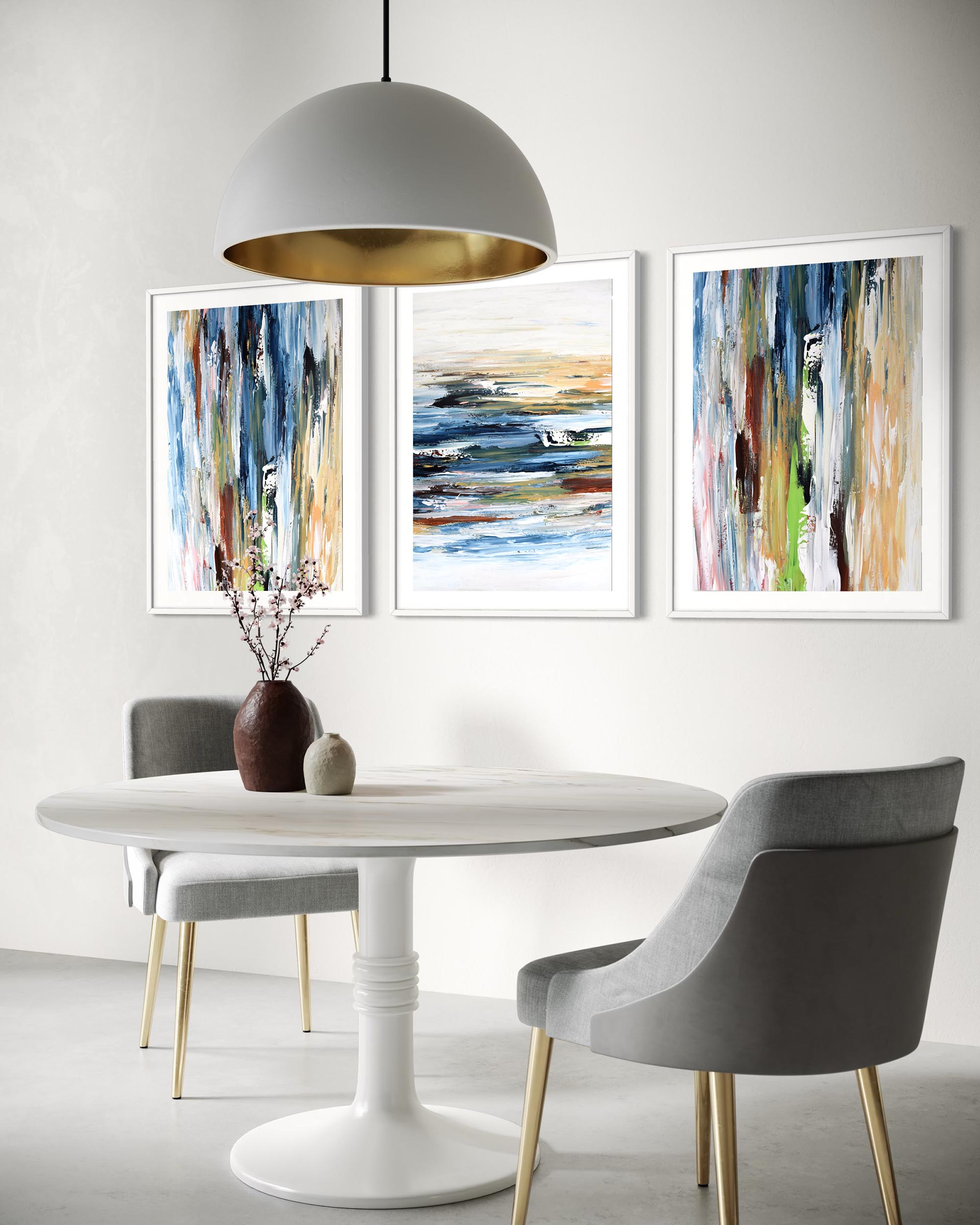 Dining room with a white table, gray chairs, and abstract art on the wall.