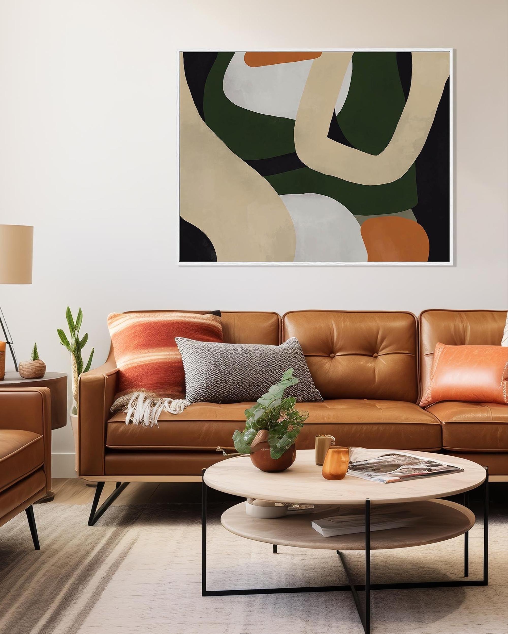 Modern living room with brown leather sofa, abstract art, and decorative items.