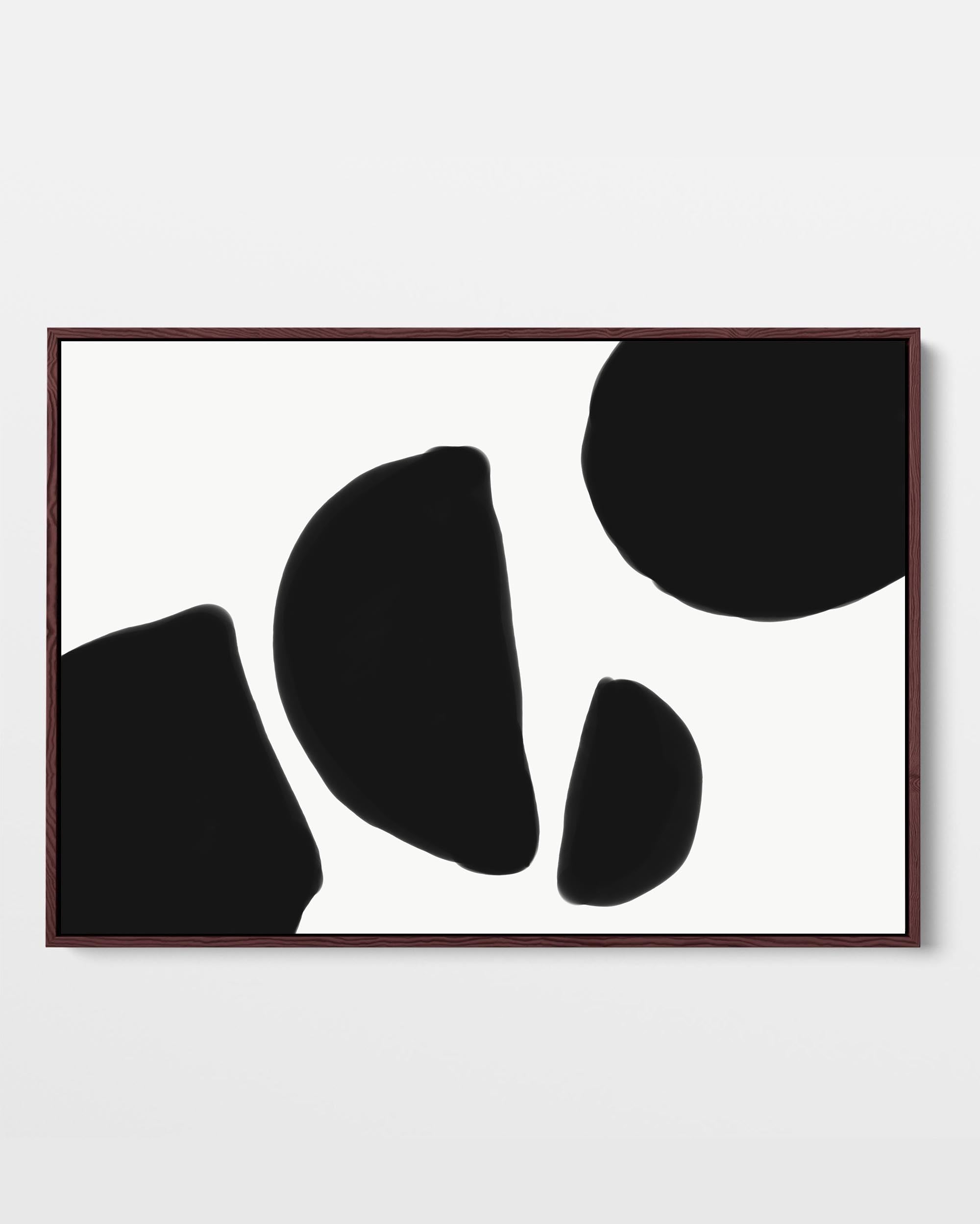 A framed canvas print featuring an abstract black and white shape design, with large black shapes on a white background, presented in a simple black frame.