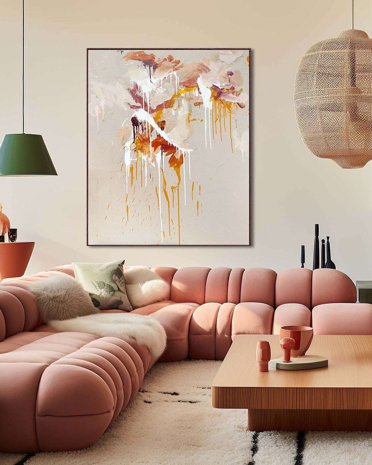 Modern living room with a pink sofa, abstract art, and wooden coffee table.