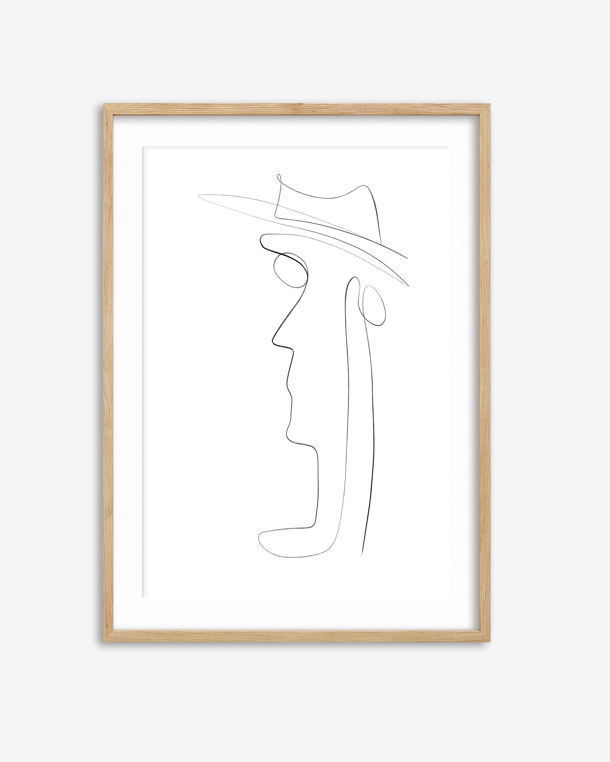 Framed line art of a face with a hat on a white background