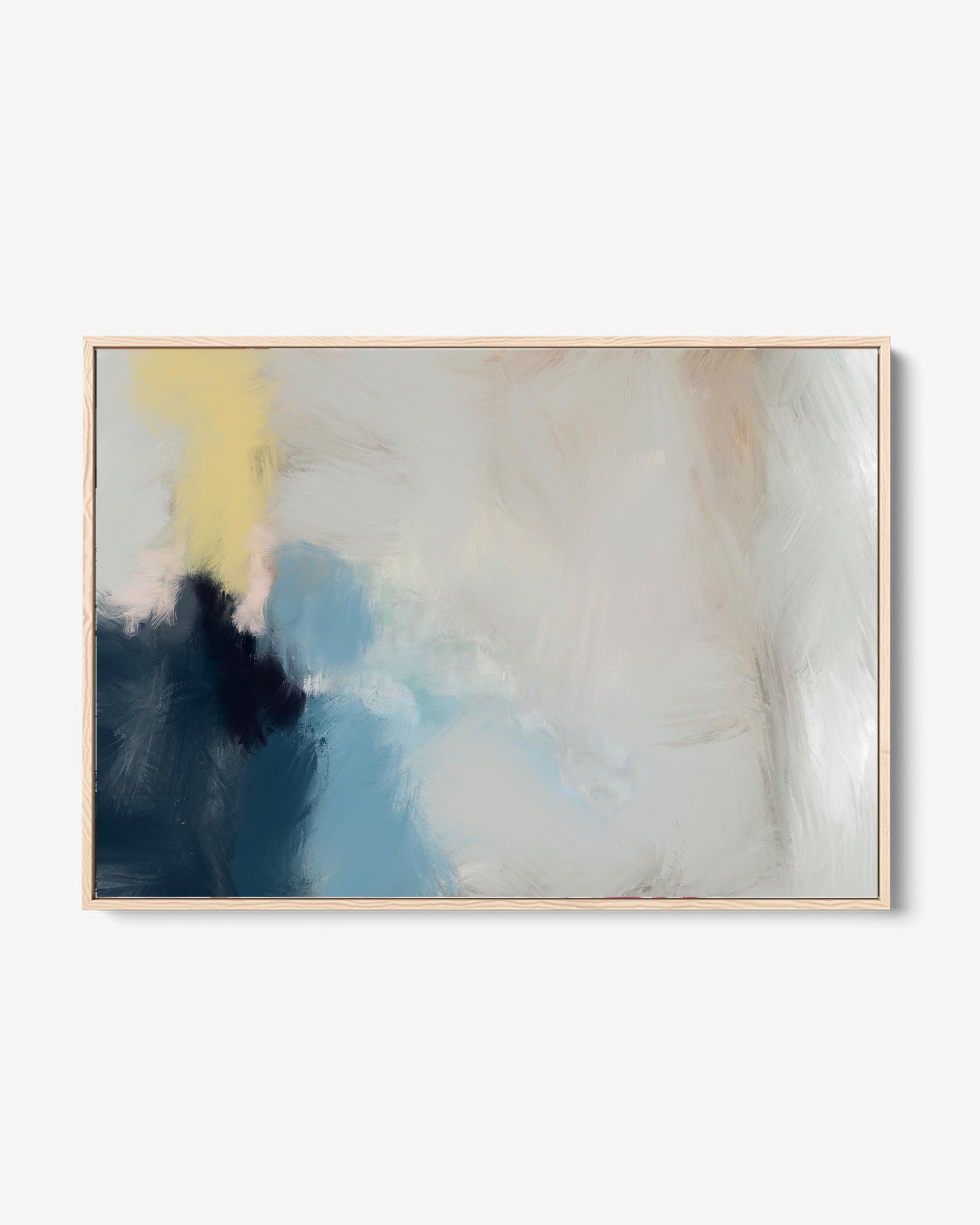 A framed canvas abstract art piece with neutral greys and whites displayed above a gray sofa in a well-lit living room.