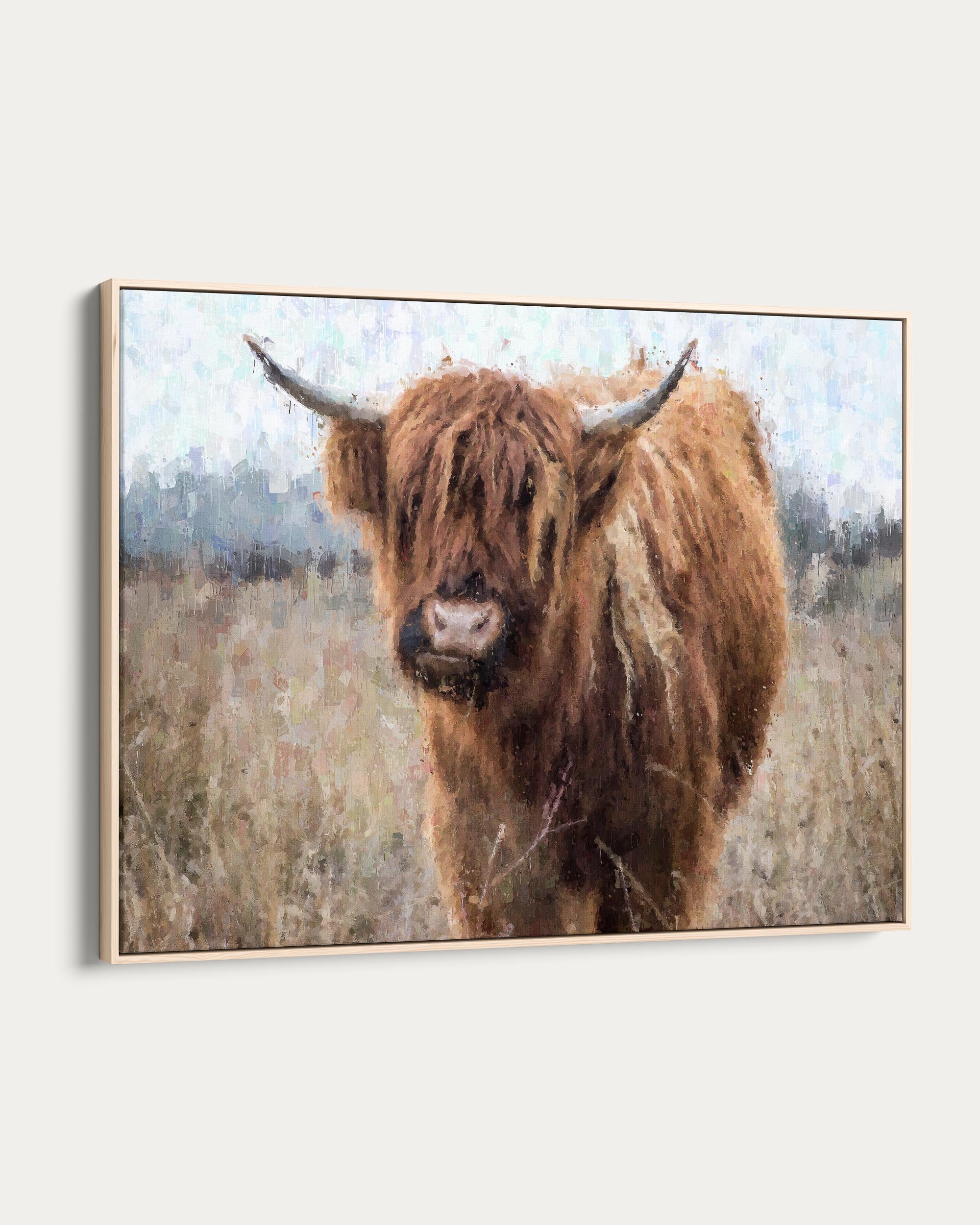 Framed artwork of a highland cow in a field