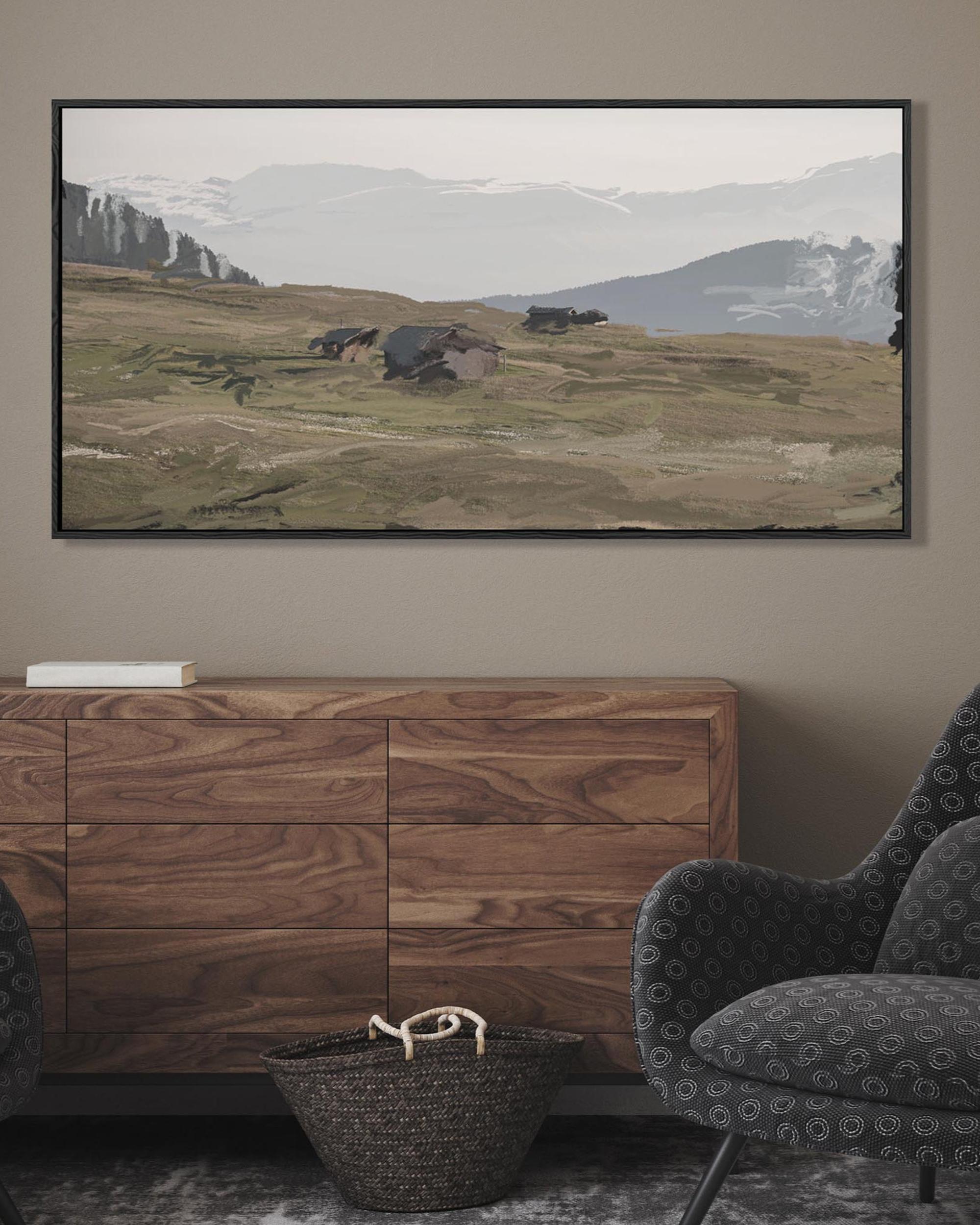 Framed landscape painting above a wooden cabinet in a room with a gray armchair.