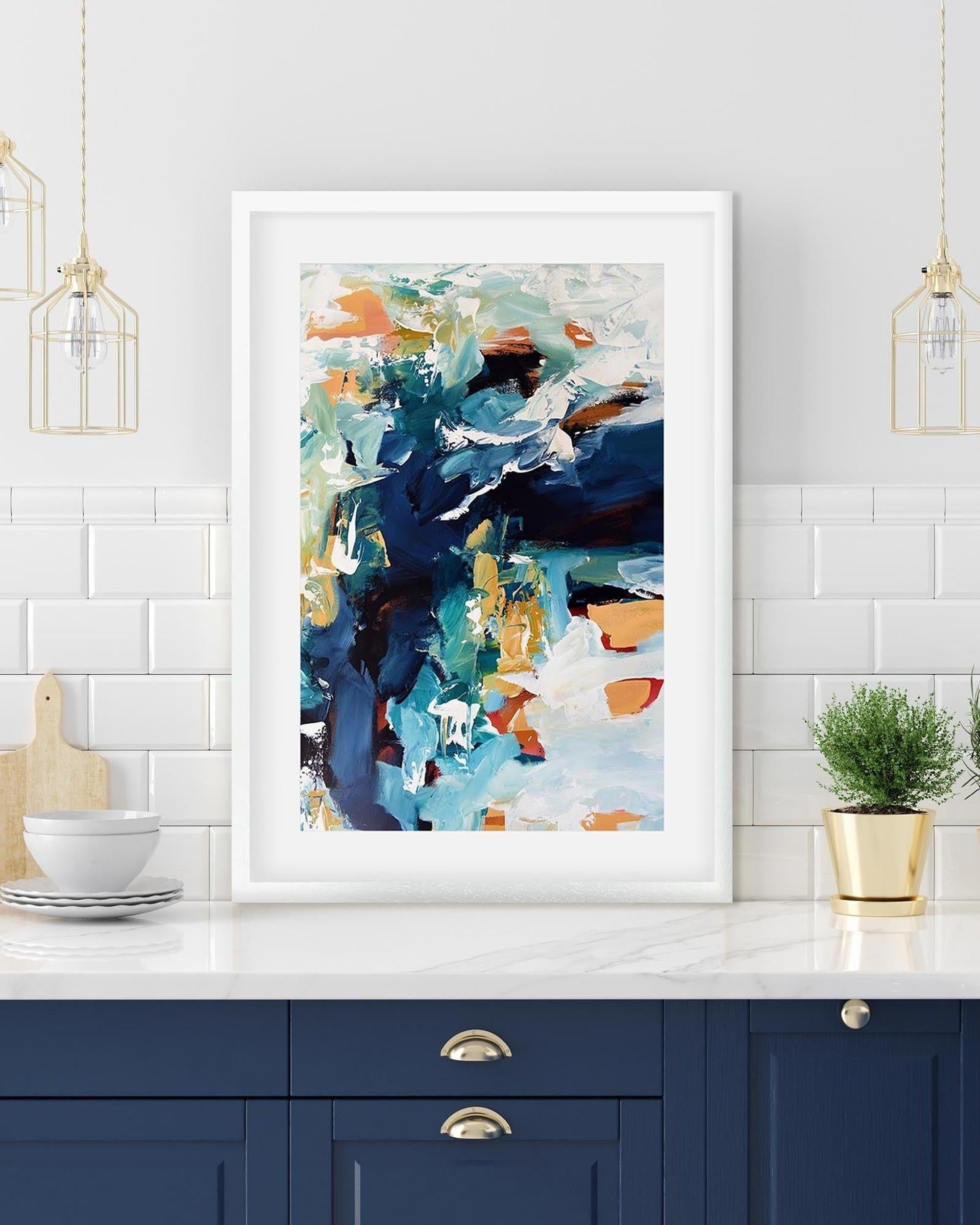 blue abstract print in a white frame in kitchen