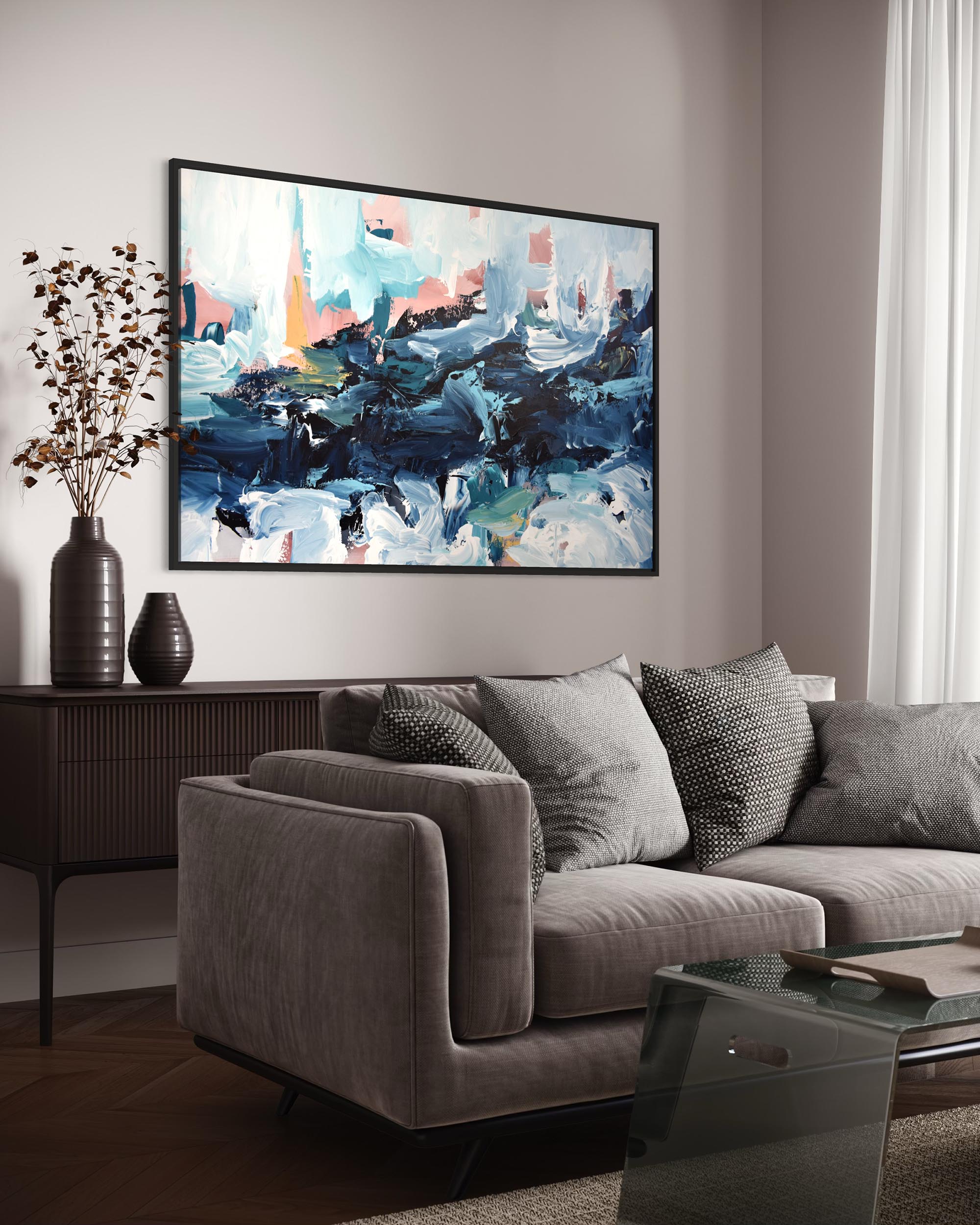 Living room with a gray sofa, abstract painting on the wall, and decorative elements.