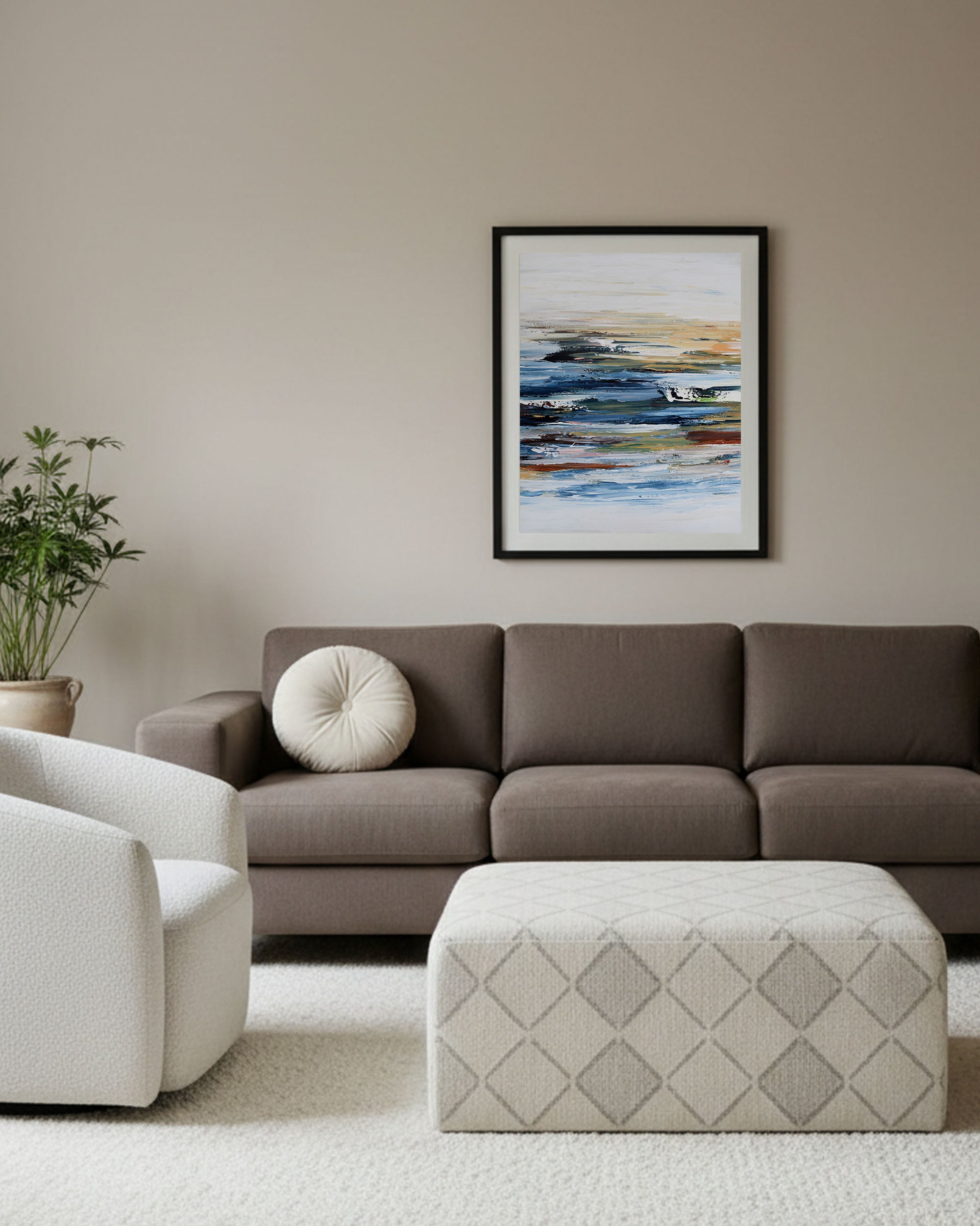 modern japandi aesthetic living space with extra large blue abstract seascape framed picture on living room wall.