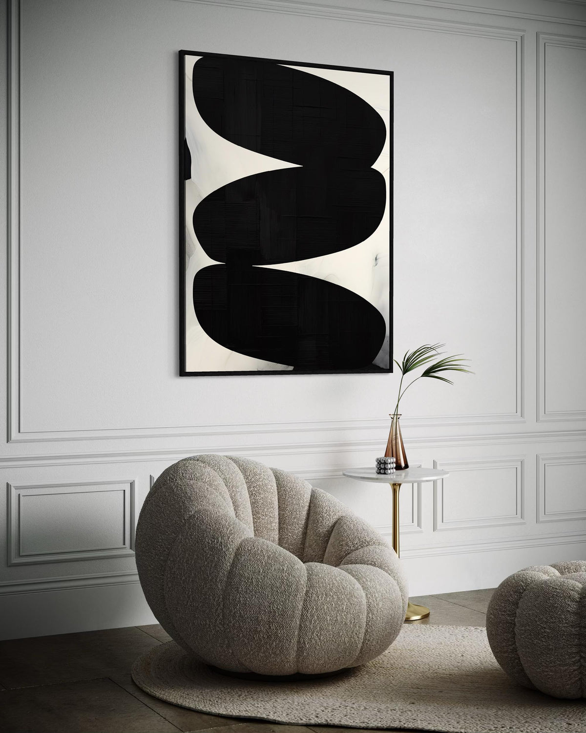Modern interior with abstract art and a textured chair.
