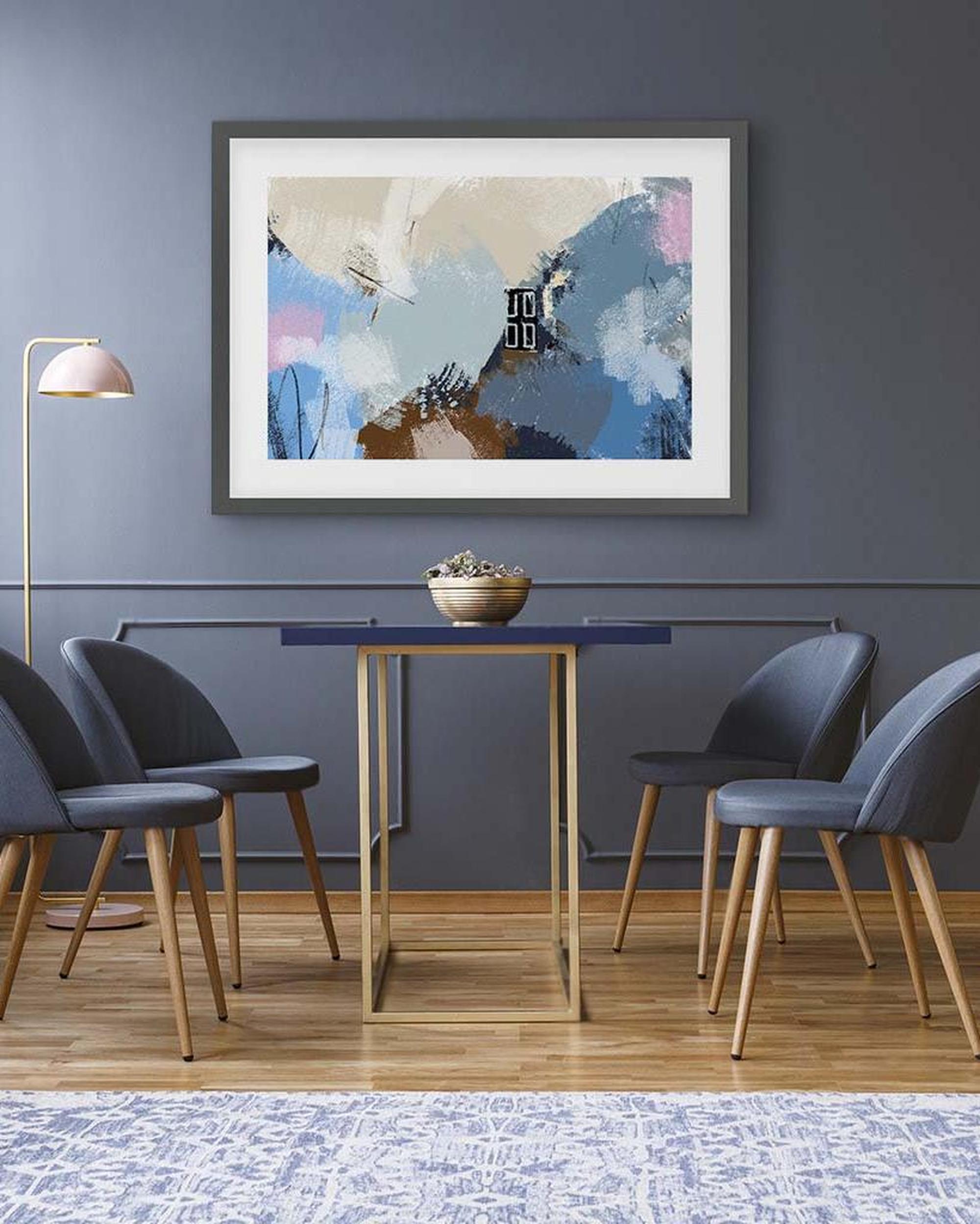 Dining room with abstract art on the wall, table, and chairs.