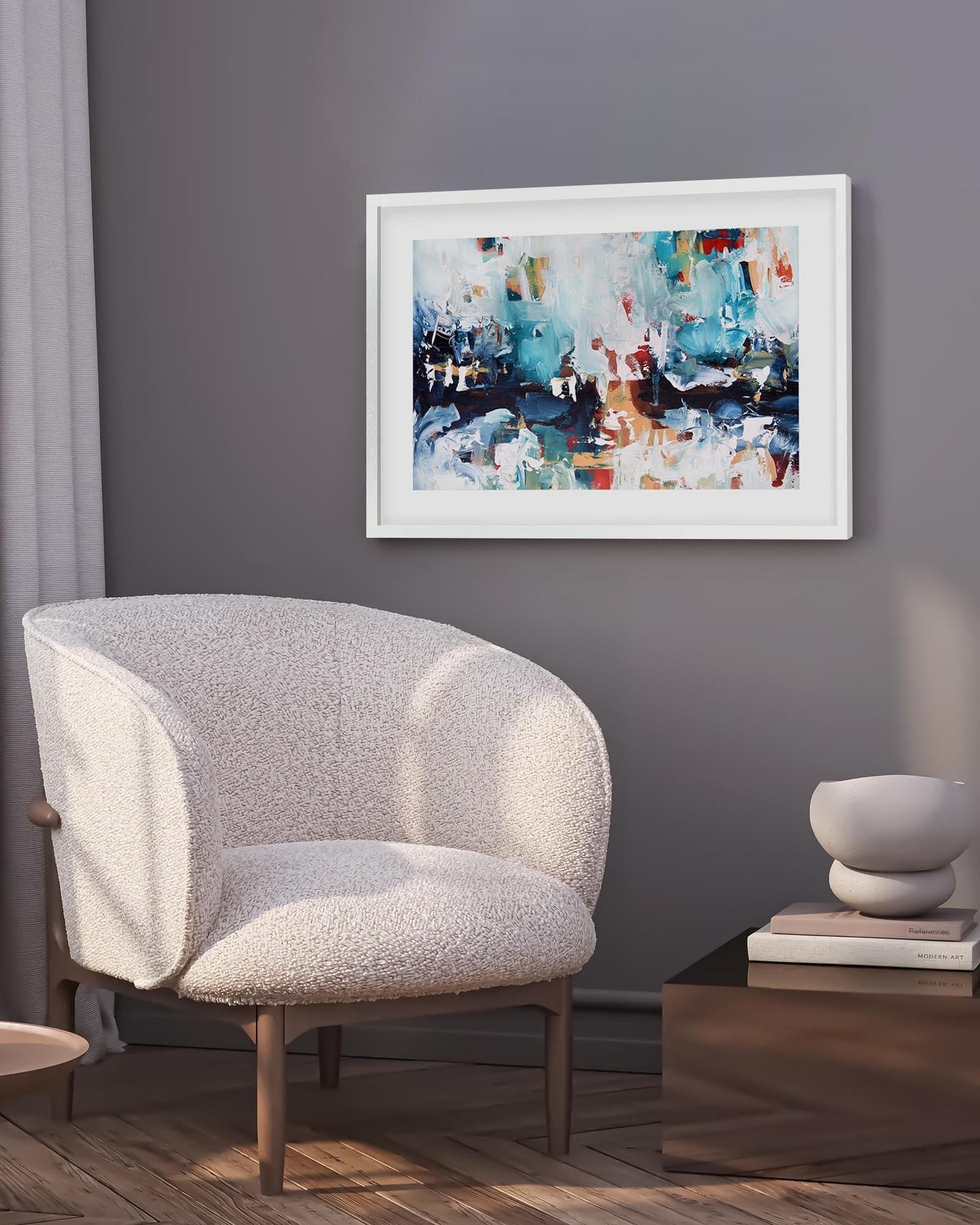 abstract art print in a white frame on a grey wall in a modern living room